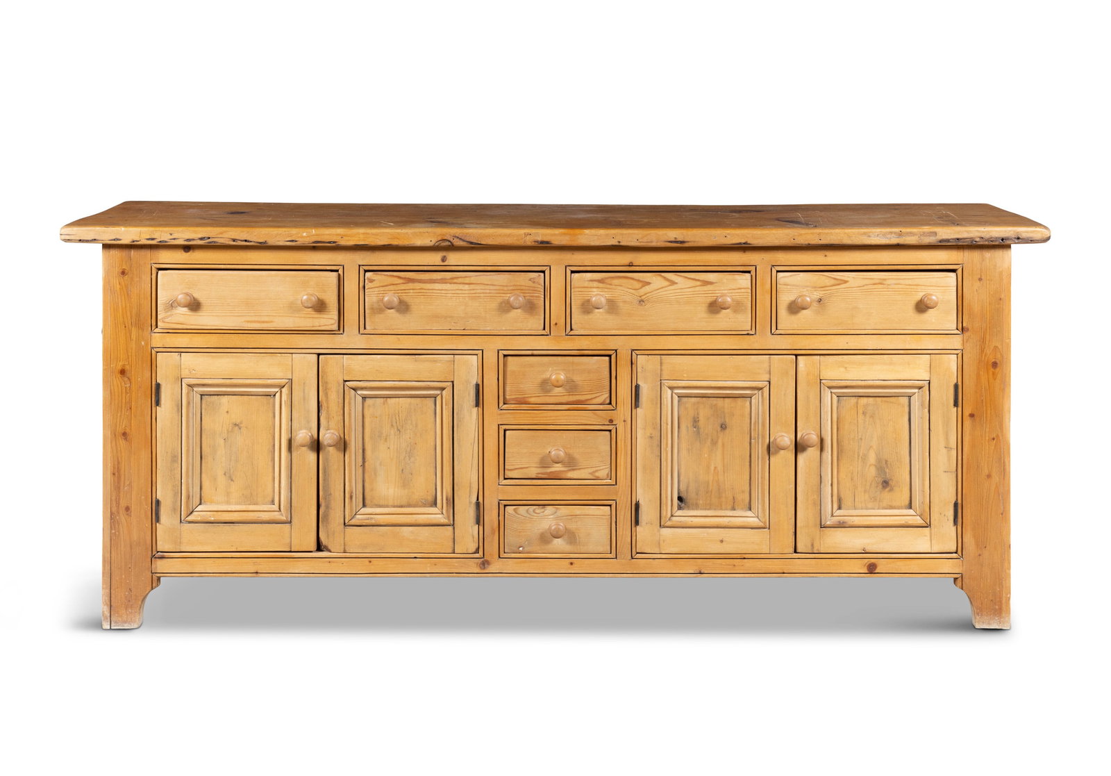 A PINE DRESSER BASE, fitted with four drawers above twin cupboard doors and three small drawers at (1 of 4)