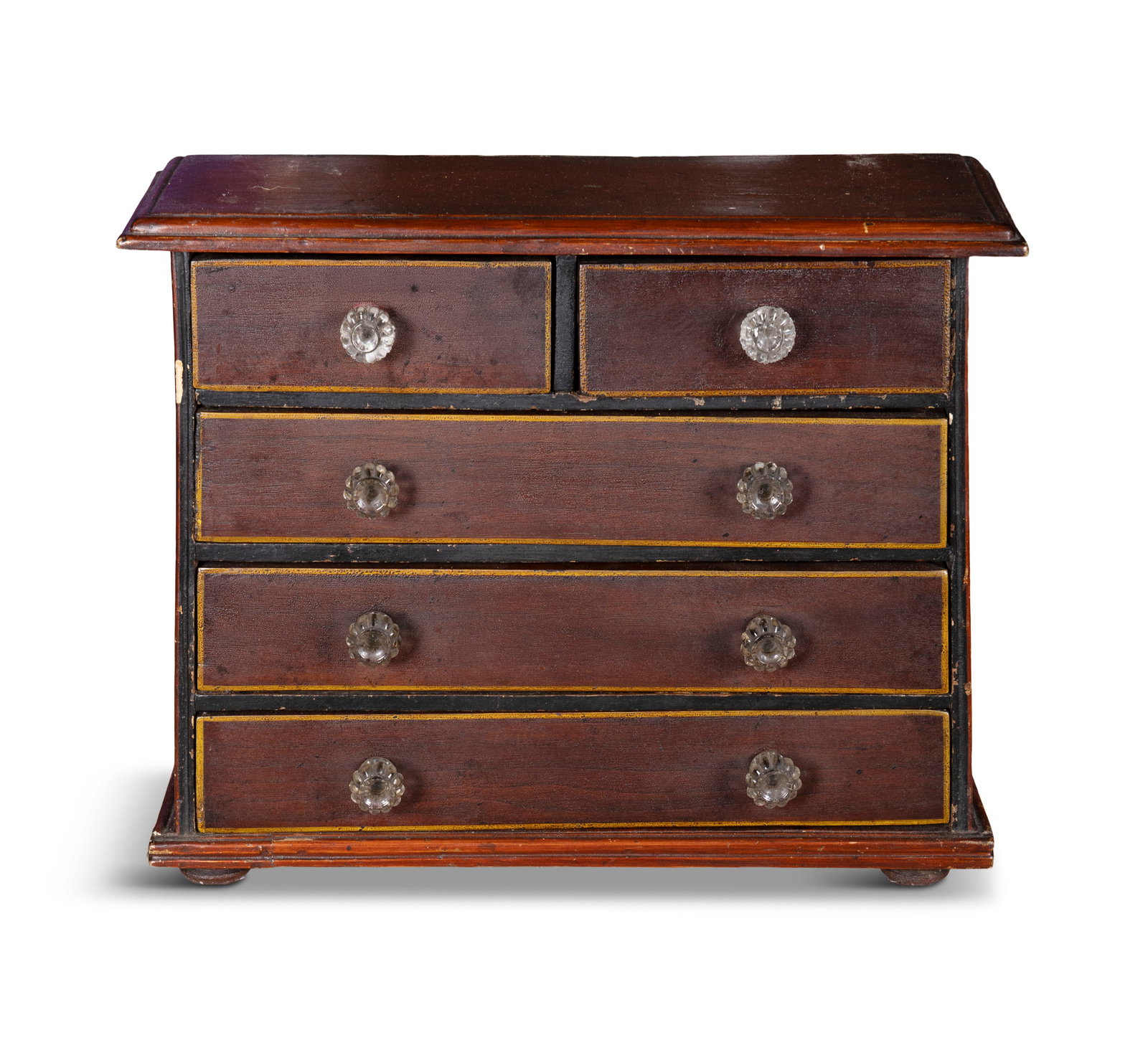 A STAINED PINE MINIATURE CHEST OF DRAWERS, comprising of two short and three long doors with (1 of 3)