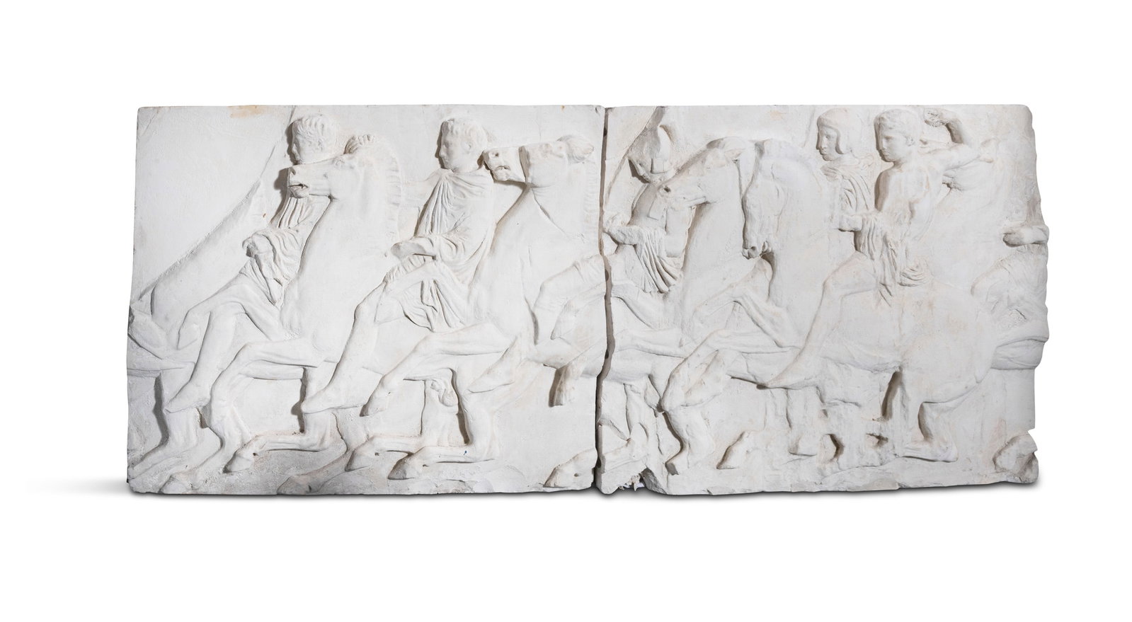 TWO PLASTER RELIEF PLANELS AFTER THE PARTHENON FRIEZE depicting cavalry on horseback, in two (1 of 3)