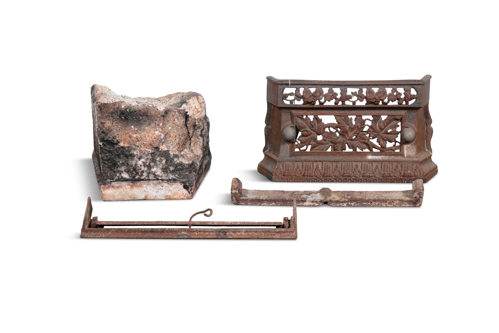 A CAST IRON FIRE GRATE, 19TH CENTURY, with pierced foliate scrolled panel, 42cm wide (1 of 6)