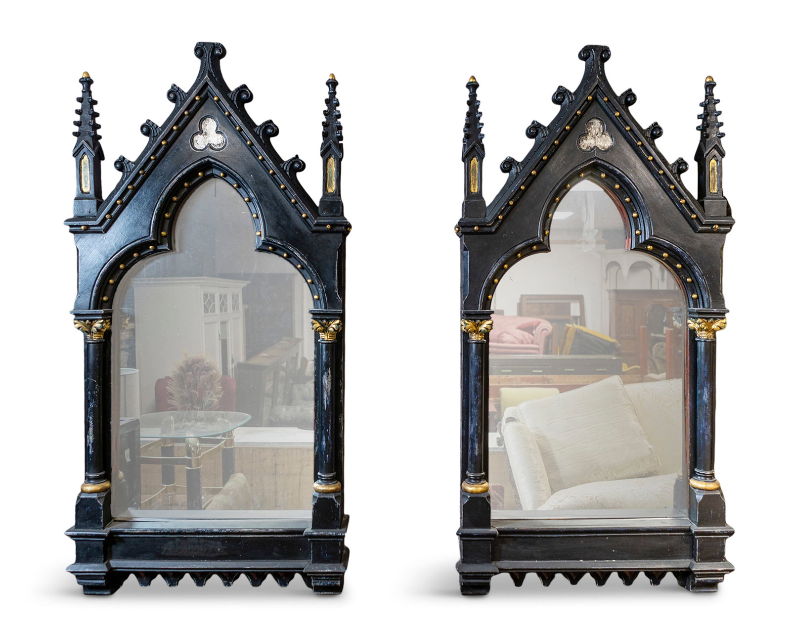 A PAIR OF GOTHIC STYLE BLACK PAINTED TIMBER MIRRORS arched tops surmounted by scrollwork and (1 of 1)