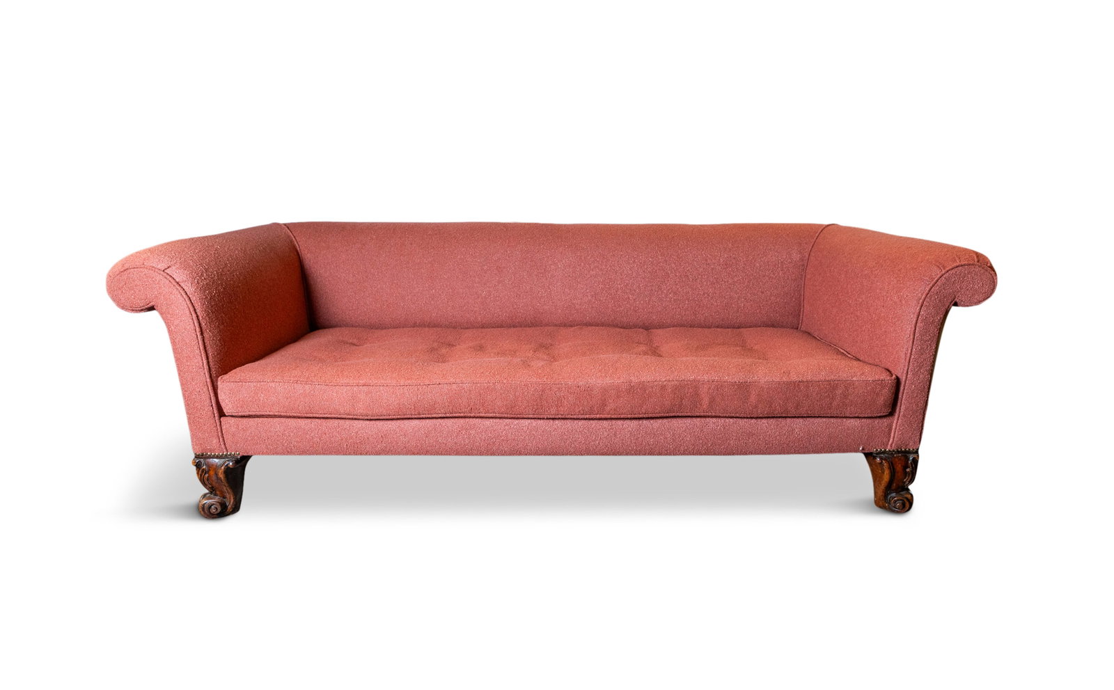 A MAHOGANY FRAMED THREE SEATER SCROLL ARM SETTEE, 19TH CENTURY upholstered in pink fabric, with: A MAHOGANY FRAMED THREE SEATER SCROLL ARM SETTEE, 19TH CENTURY upholstered in pink fabric, with brass studding, on scroll feet. 70cm high, 215cm long, 90cm deep