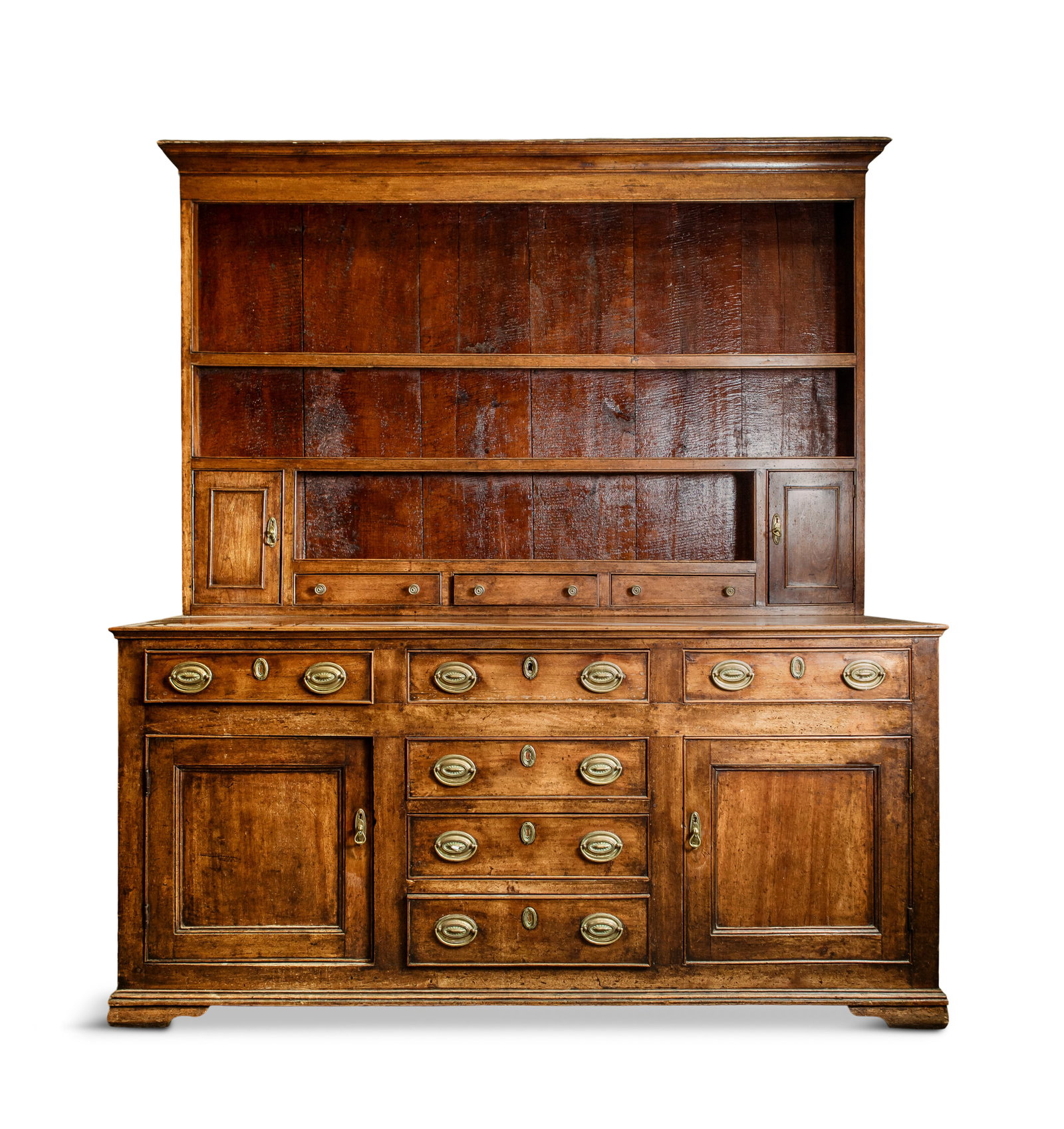 AN 18TH CENTURY OAK WELSH DRESSER the upper section with outset cornice over an open shelving with (1 of 2)