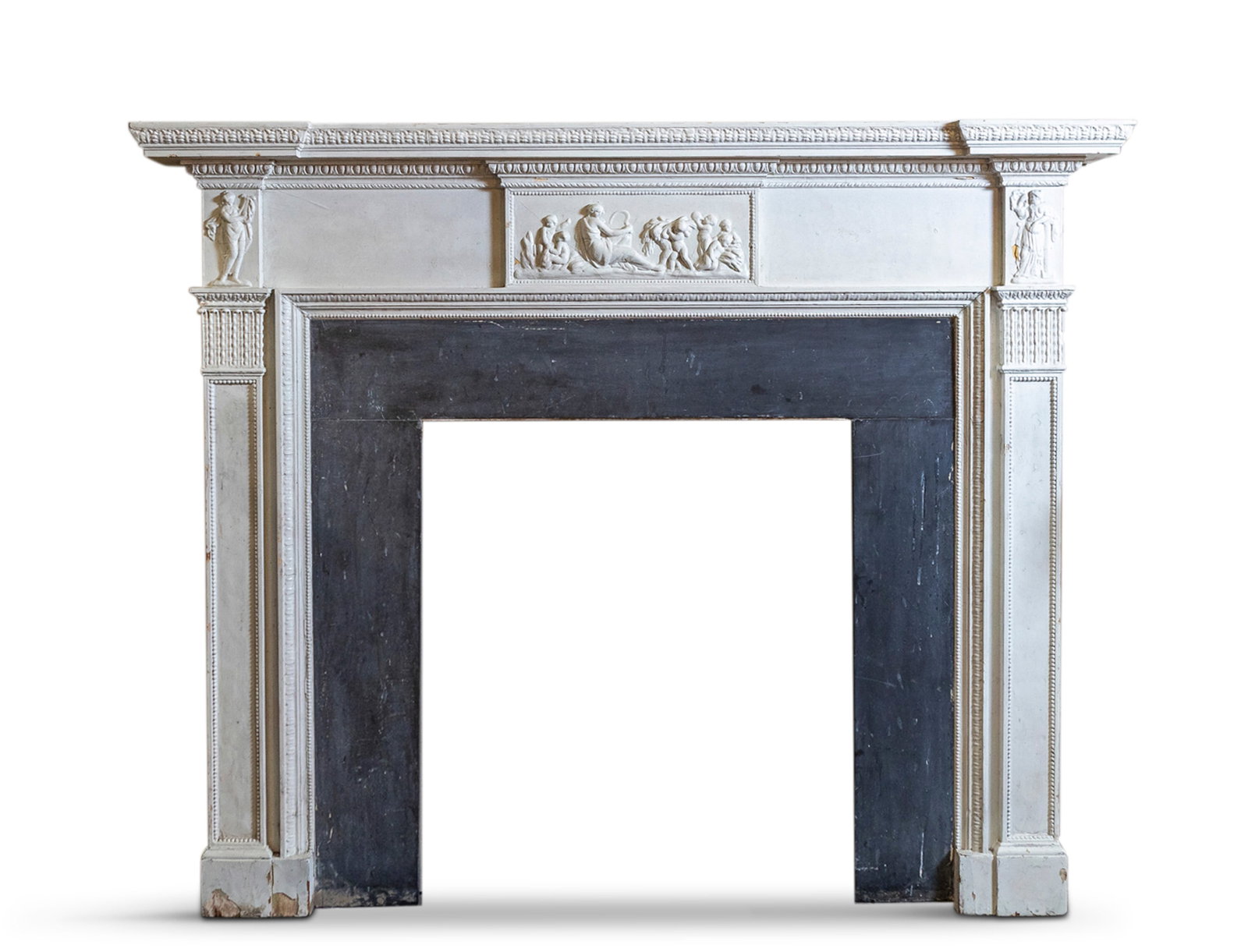 A WHITE PAINTED TIMBER FIREPLACE WITH GREY SLATE INSERT with outset mantel with egg and dart: A WHITE PAINTED TIMBER FIREPLACE WITH GREY SLATE INSERT with outset mantel with egg and dart moulding, over a frieze centred with a depiction of Demeter holding a scythe and surrounded by putti with s