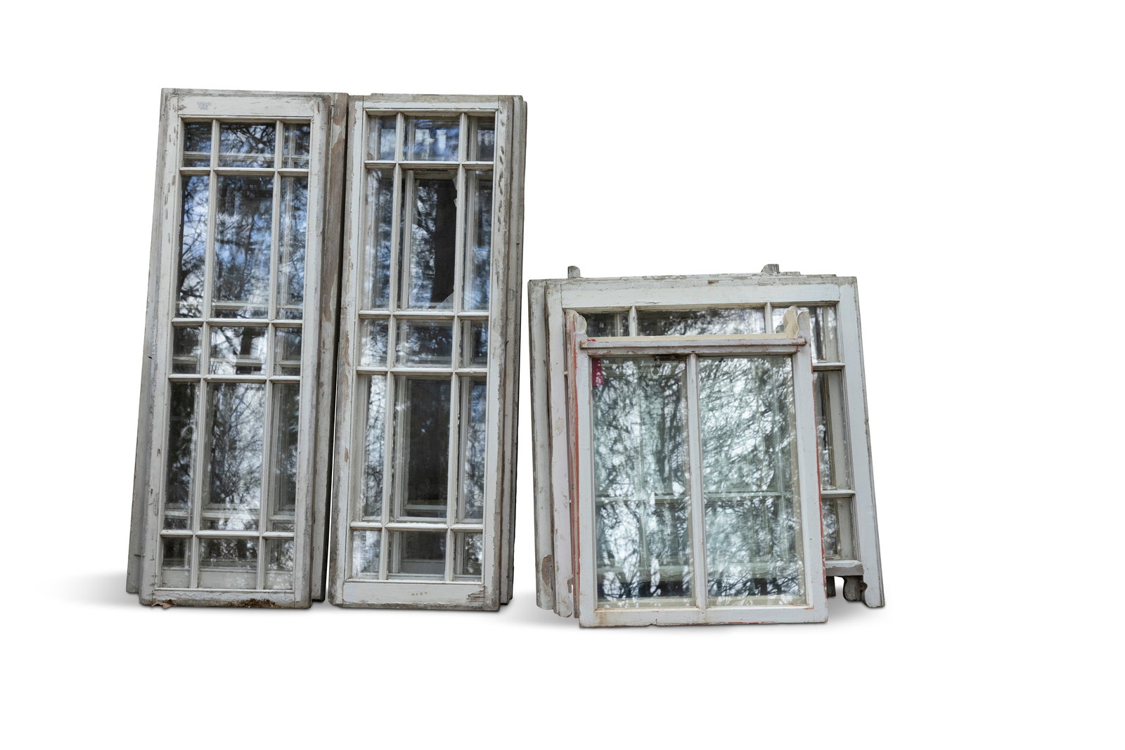 A MIXED SELECTION OF SIXTEEN SALVAGED WHITE-PAINTED SASH WINDOWS, Of timber construction comprising: A MIXED SELECTION OF SIXTEEN SALVAGED WHITE-PAINTED SASH WINDOWS, Of timber construction comprising; (i) eight tall narrow windows of fifteen pane design, 132 x 42.5cm (ii) two of nine pane design, 76
