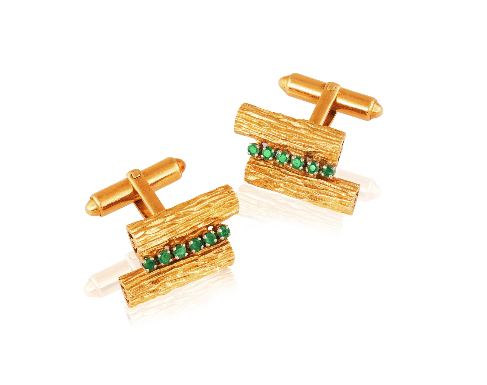 A PAIR OF EMERALD CUFFLINKS • Circular-cut emeralds • mounted in 18K gold • length (1 of 2)