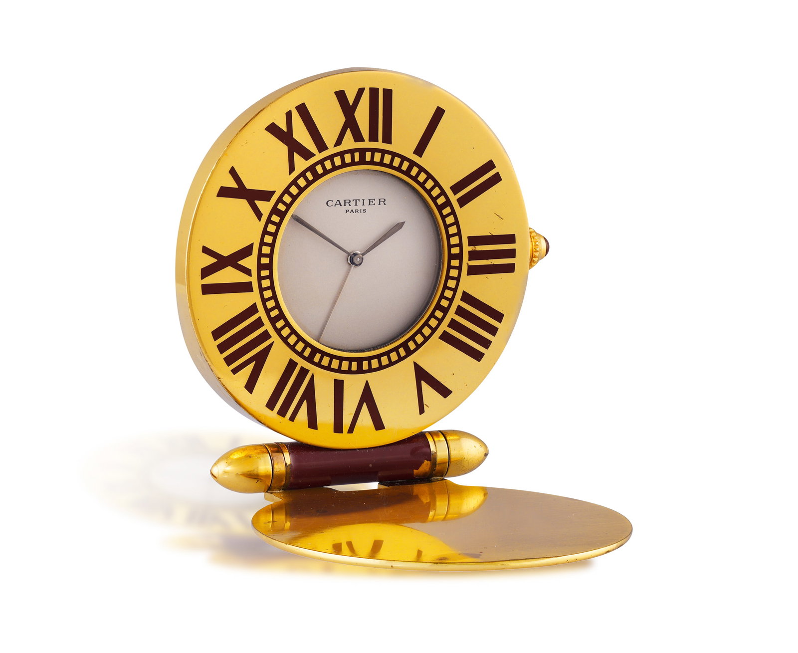CARTIER: A 'PENDULETTE' TRAVEL ALARM CLOCK • Quartz movement • circular white dial (1 of 3)