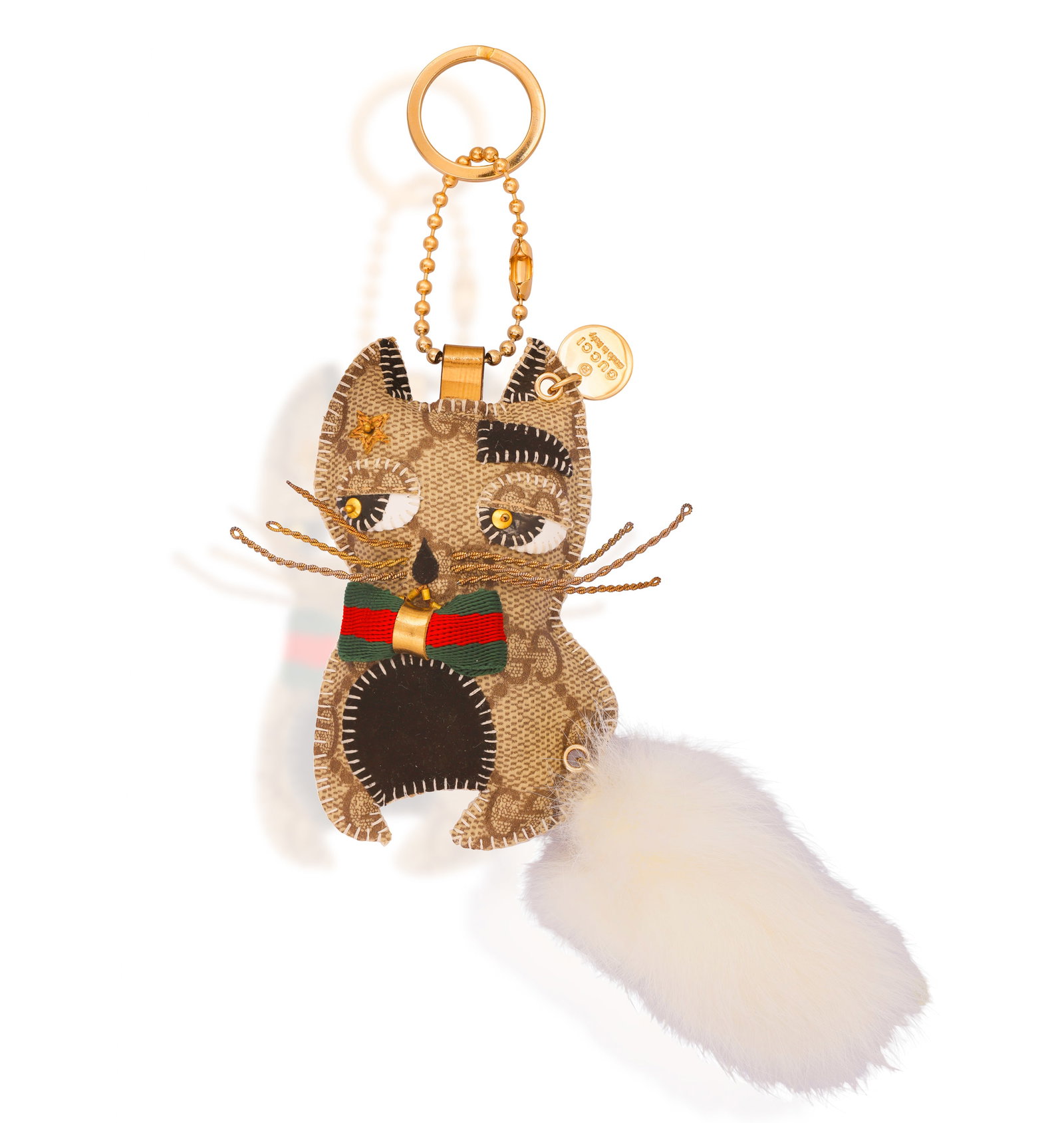 GUCCI: A 'GATTOLI ORESTE' LEATHER KEY CHAIN • Designed as a stylised cat • twisted wire (1 of 3)