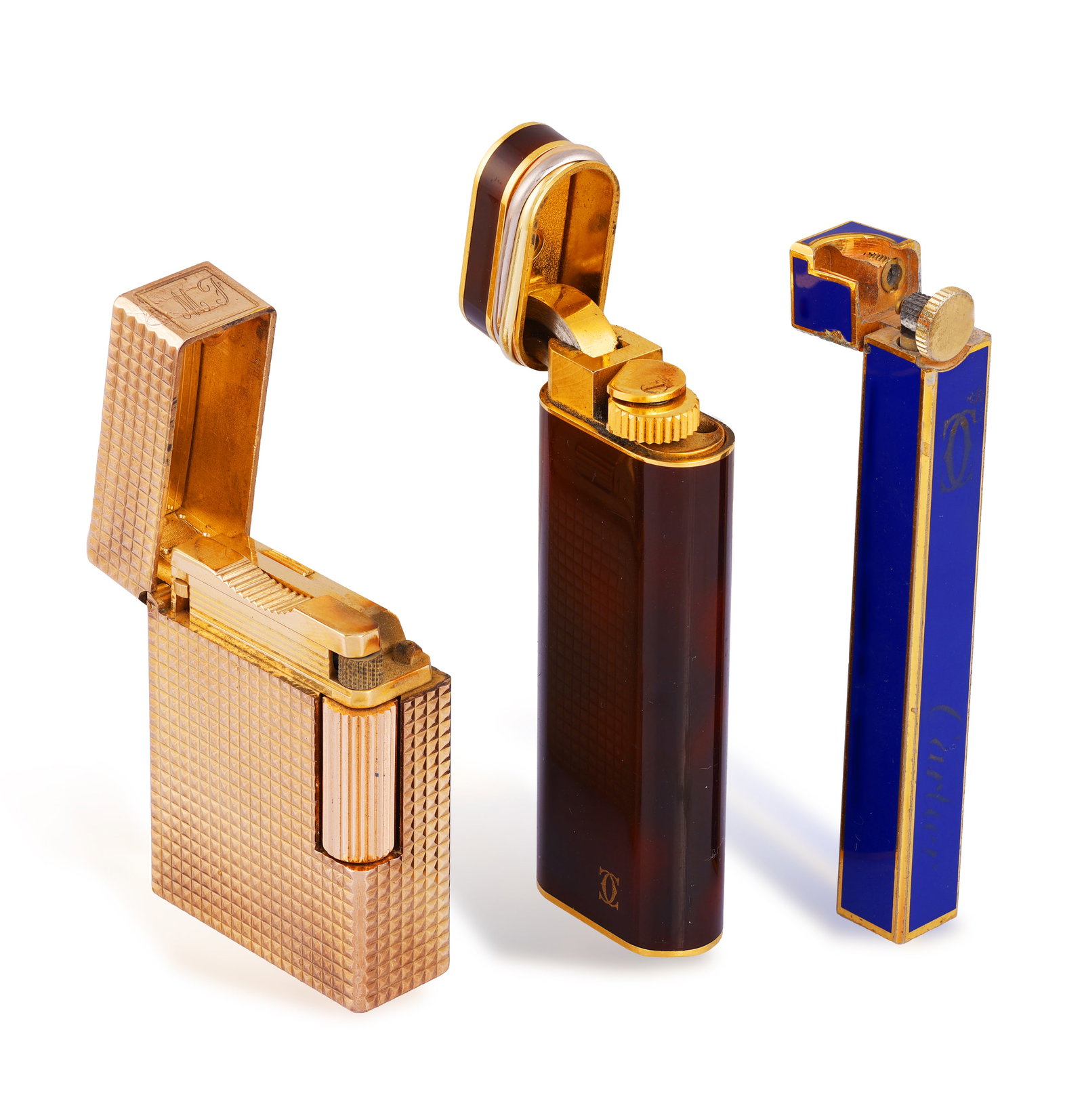 DUPONT, CARTIER: A COLLECTION OF THREE LIGHTERS • A S.T. Dupont textured lighter with ''MF': DUPONT, CARTIER: A COLLECTION OF THREE LIGHTERS • A S.T. Dupont textured lighter with ''MF' engraved initials • signed 'S.T. Dupont Paris, Made in France' • numbered • length 4