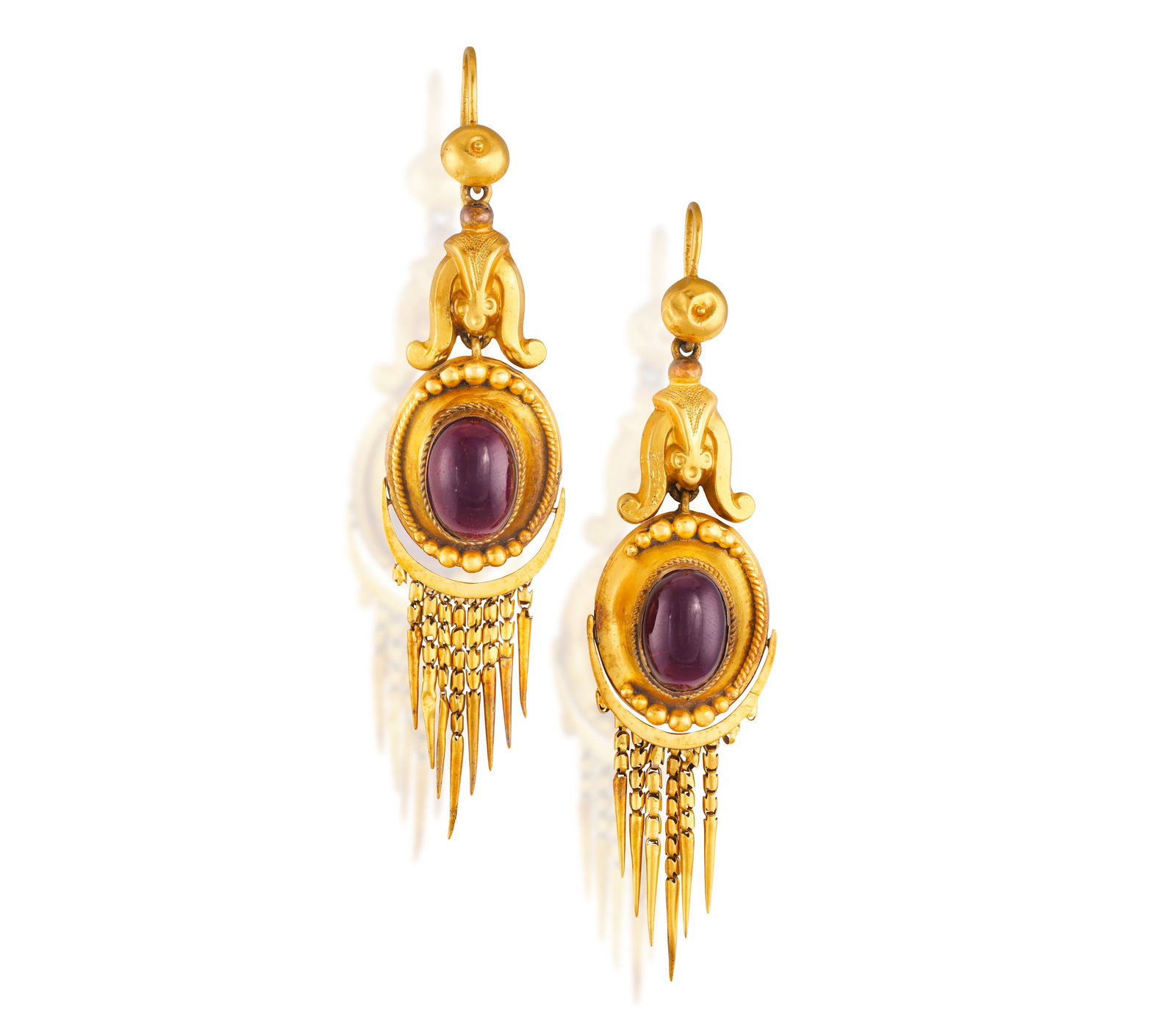 A PAIR OF 19TH CENTURY GARNET PENDENT EARRINGS • Two oval-shaped garnet cabochons • tass (1 of 2)