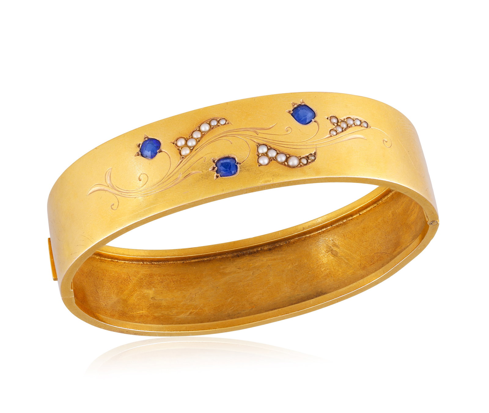 A LATE 19TH CENTURY BLUE STONE AND SEED PEARL BANGLE • Cushion-shaped blue stones • seed (1 of 2)