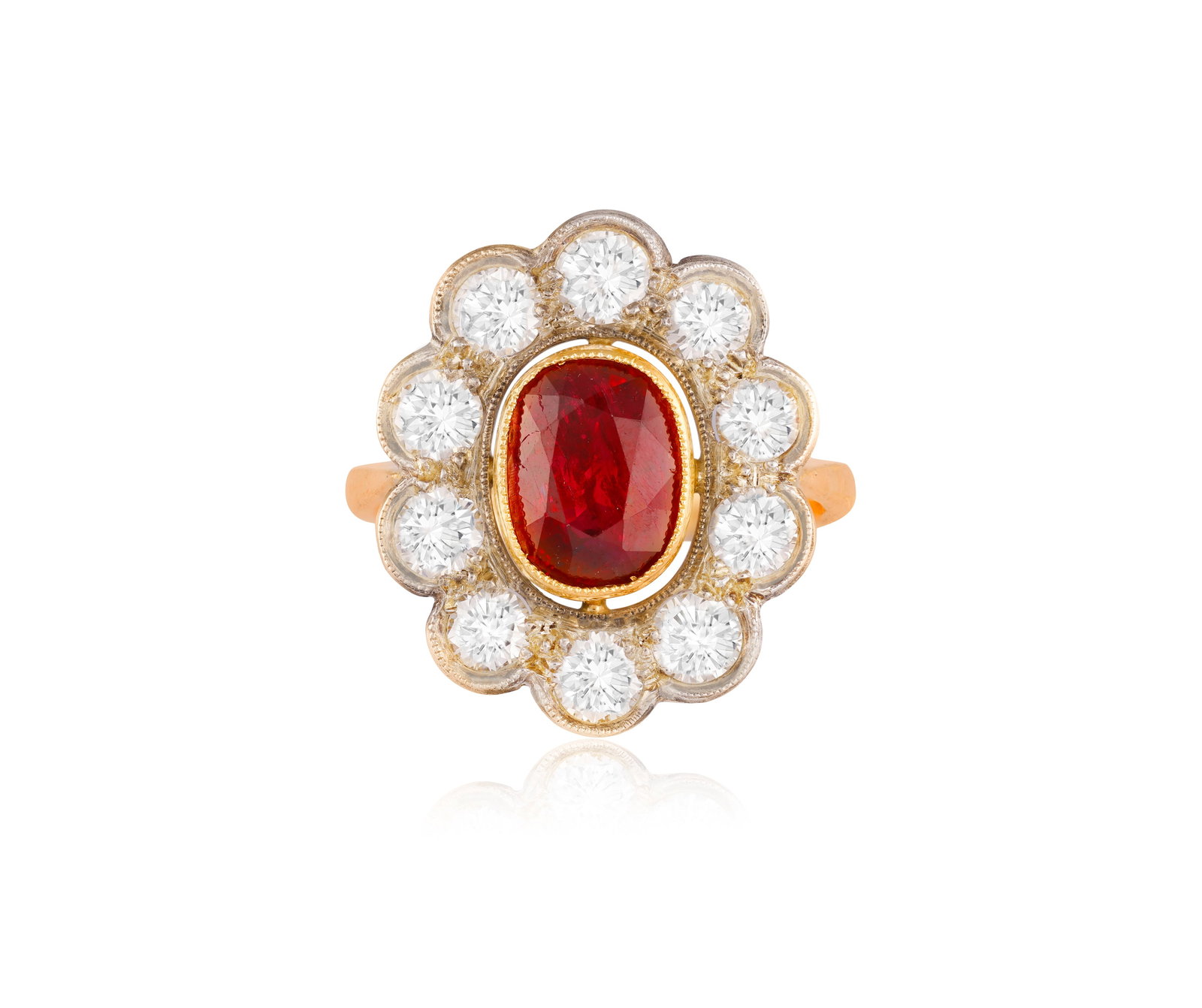 A RUBY AND DIAMOND CLUSTER RING • Set with an oval-shaped ruby • brilliant-cut diamonds, (1 of 4)