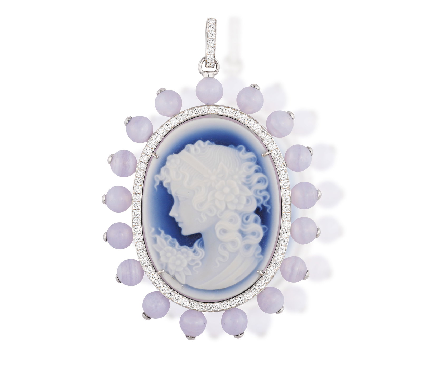 A CHALCEDONY AND DIAMOND CAMEO PENDANT • Depicting a lady in profile • an oval-shaped (1 of 2)