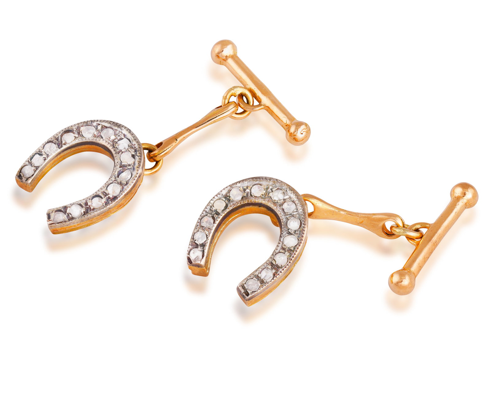 A PAIR OF DIAMOND CUFFLINKS • Each horseshoe with rose-cut diamonds • mounted in 14K gol: A PAIR OF DIAMOND CUFFLINKS • Each horseshoe with rose-cut diamonds • mounted in 14K gold • Italian registry mark • length 1.3cm *This lot is sold without a reserve