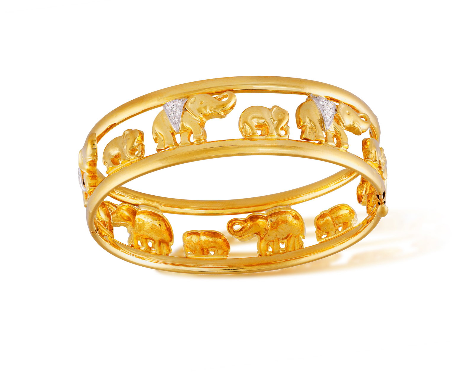 A DIAMOND BANGLE • Elephant motifs • brilliant-cut diamond highlights • mounted in (1 of 4)