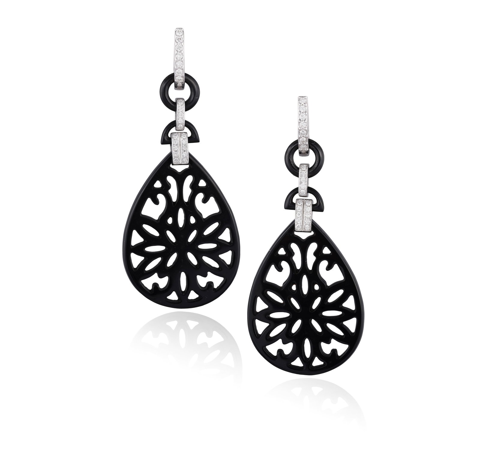 A PAIR OF ONYX AND DIAMOND PENDENT EARRINGS • Openwork carved onyx drops • brilliant-cut (1 of 2)