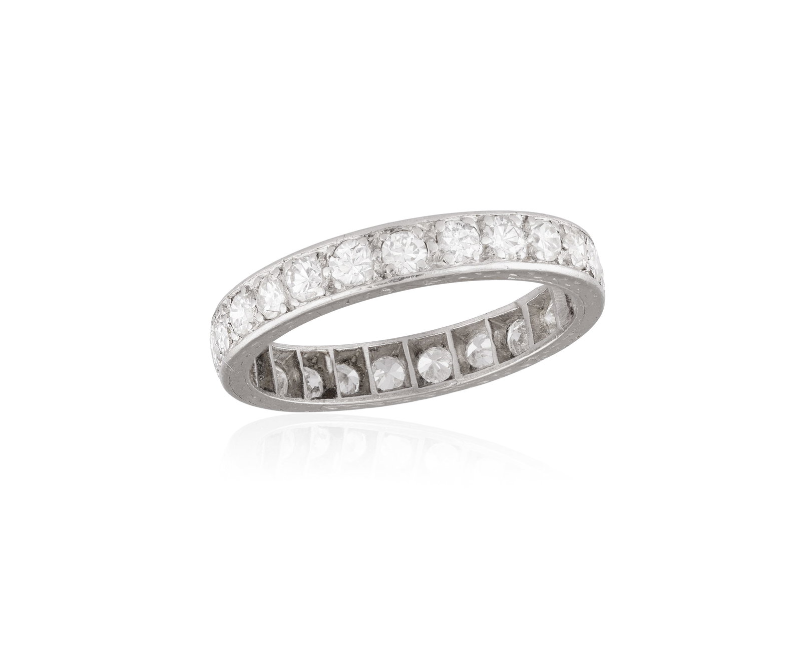 A DIAMOND ETERNITY RING • Old brilliant-cut diamonds, approx. 1.50cts total • mounted in: A DIAMOND ETERNITY RING • Old brilliant-cut diamonds, approx. 1.50cts total • mounted in platinum • ring size P⅔