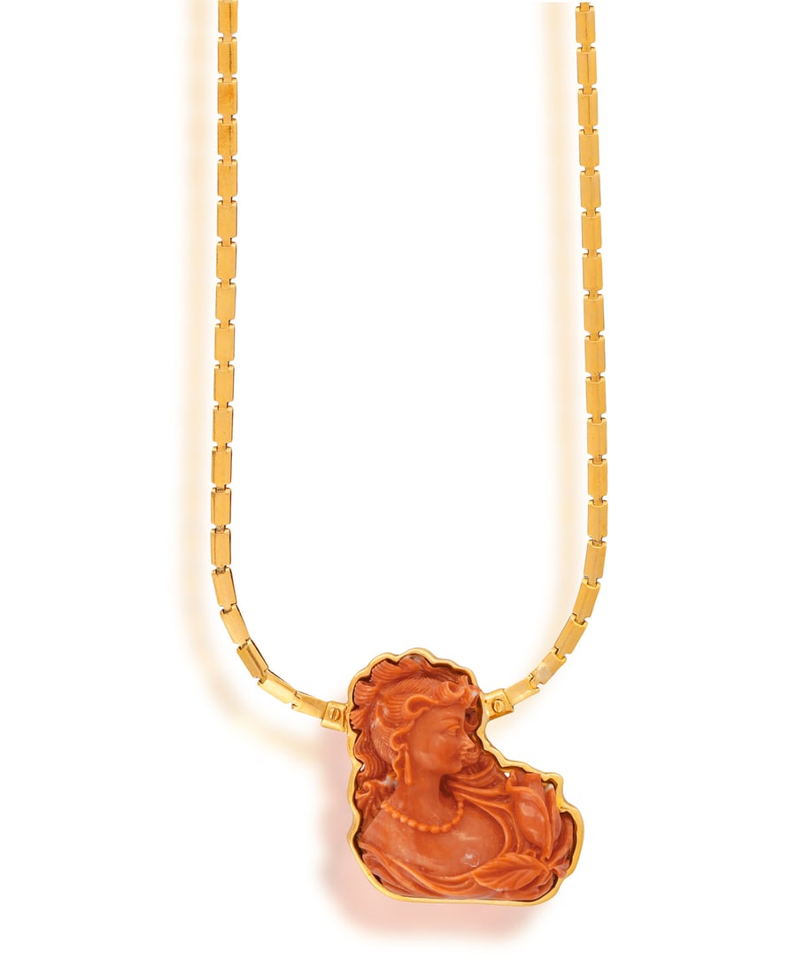 A CORAL PENDANT NECKLACE • A coral cameo depicting a lady in profile • fancy-shaped poli (1 of 3)
