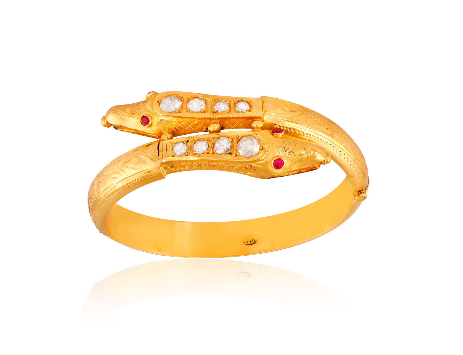 A RUBY AND ZIRCON SNAKE BANGLE • Circular-cut colourless zircons • circular-cut (possibl (1 of 3)