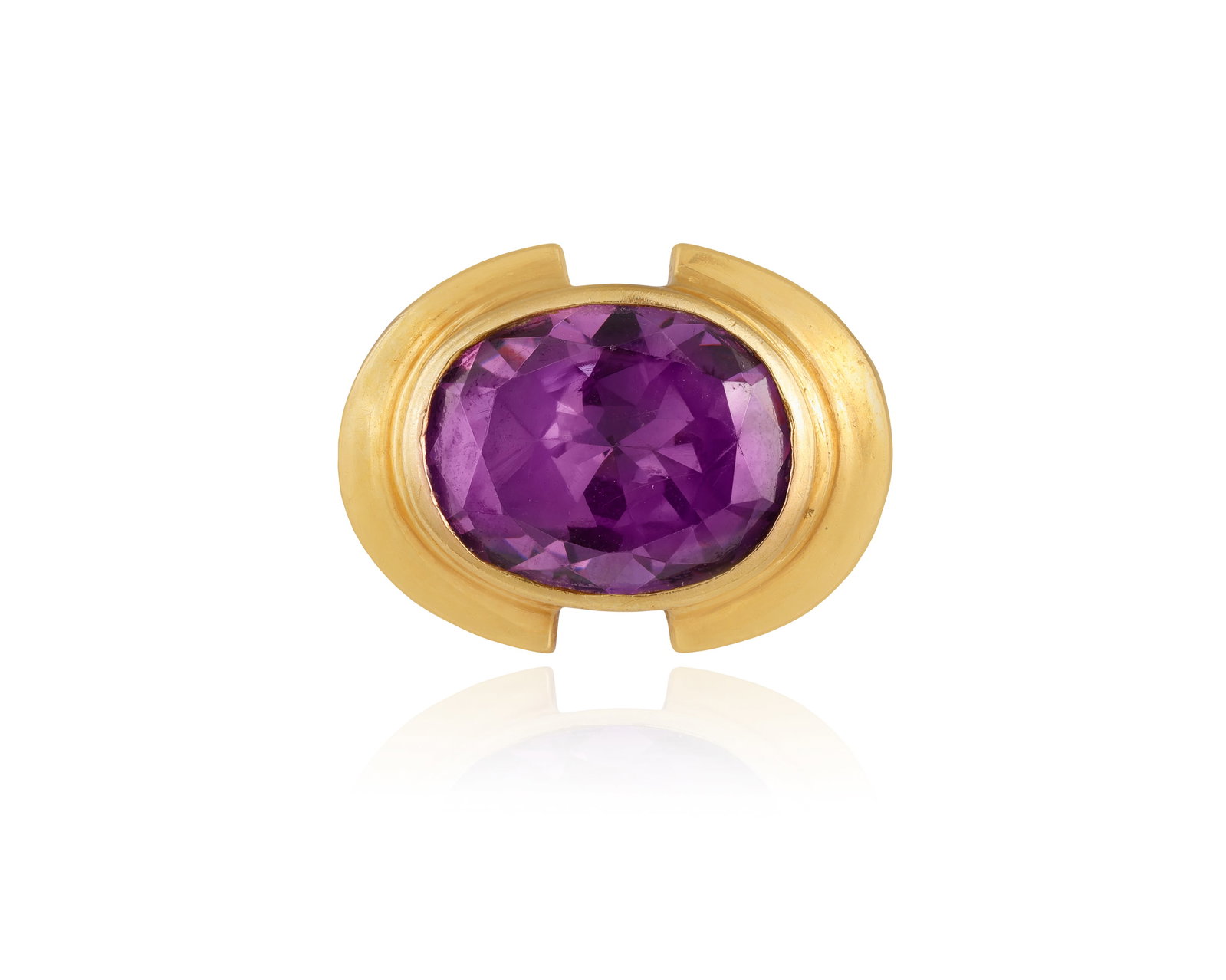 A CUBIC ZIRCONIA DRESS RING • Oval-shaped purple cubic zirconia, approx. 3.70cts total • (1 of 3)