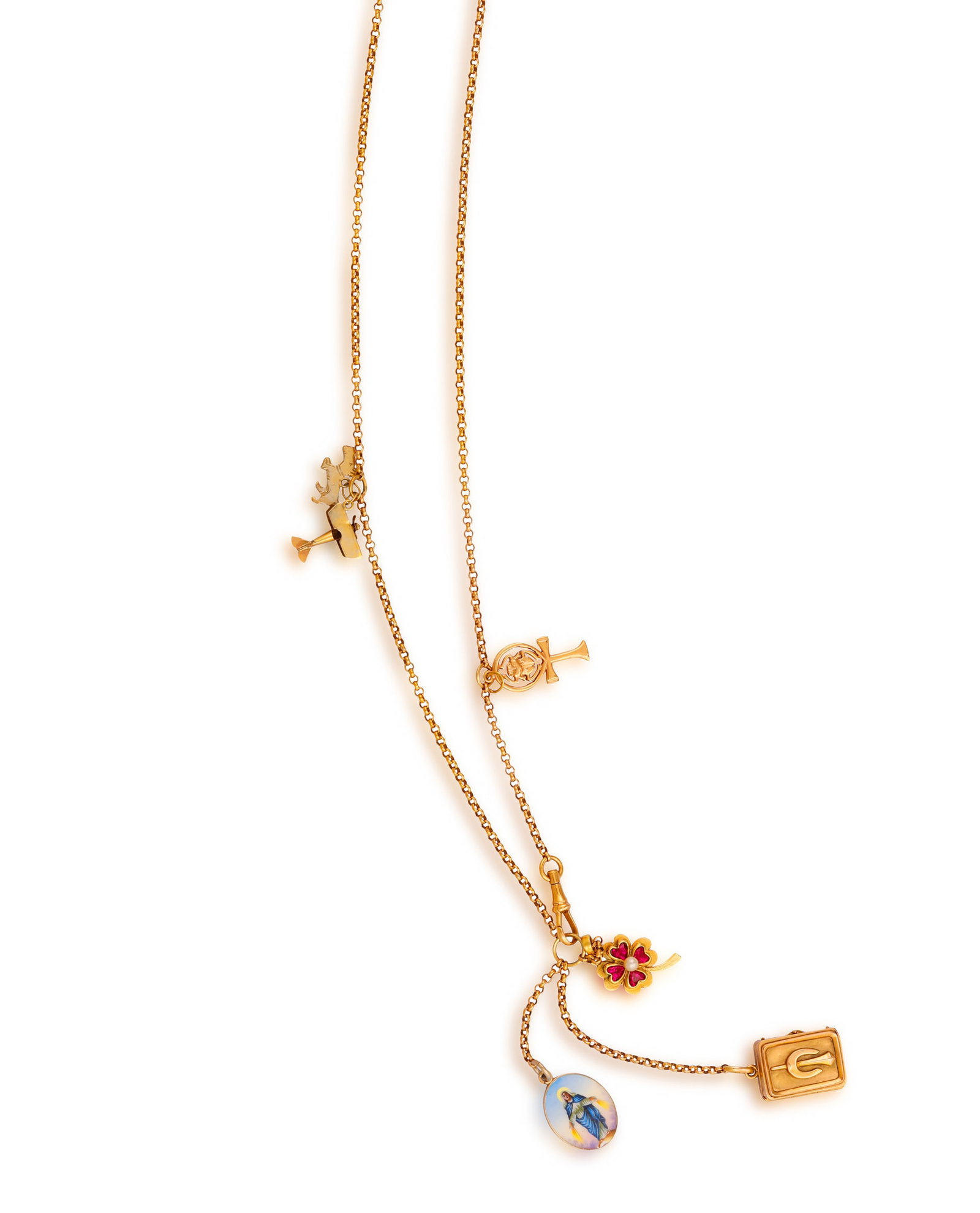 A GOLD CHARM NECKLACE • A fine cable-link chain • suspending six various charms • (1 of 3)