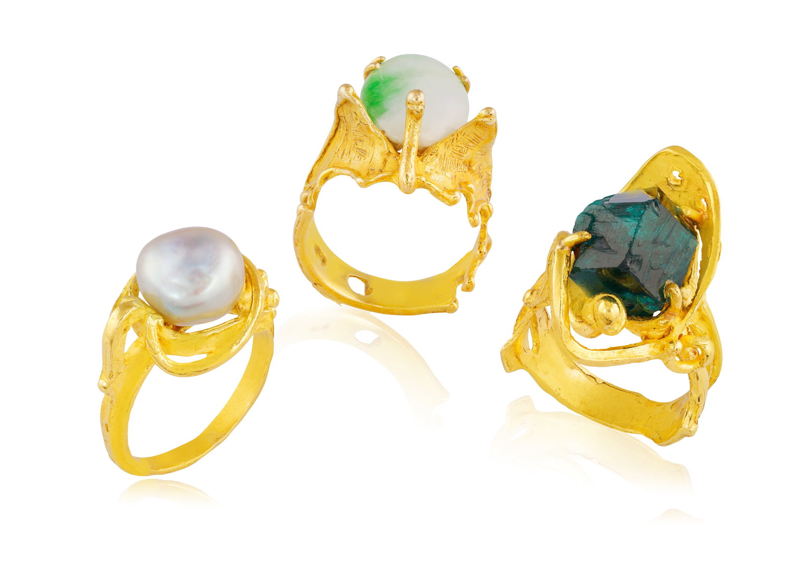 A GROUP OF THREE ABSTRACT RINGS • The first with a rough diopside • mounted in 18K gold: A GROUP OF THREE ABSTRACT RINGS • The first with a rough diopside • mounted in 18K gold • signed Fausto Maria Franchi • Italian registry mark • ring size N½; The sec