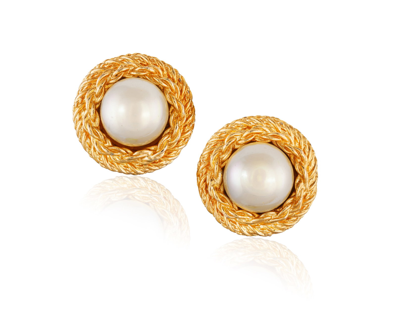 CHRISTIAN DIOR: A PAIR OF IMITATION PEARL EARCLIPS • Two imitation pearls of cream tint • (1 of 2)