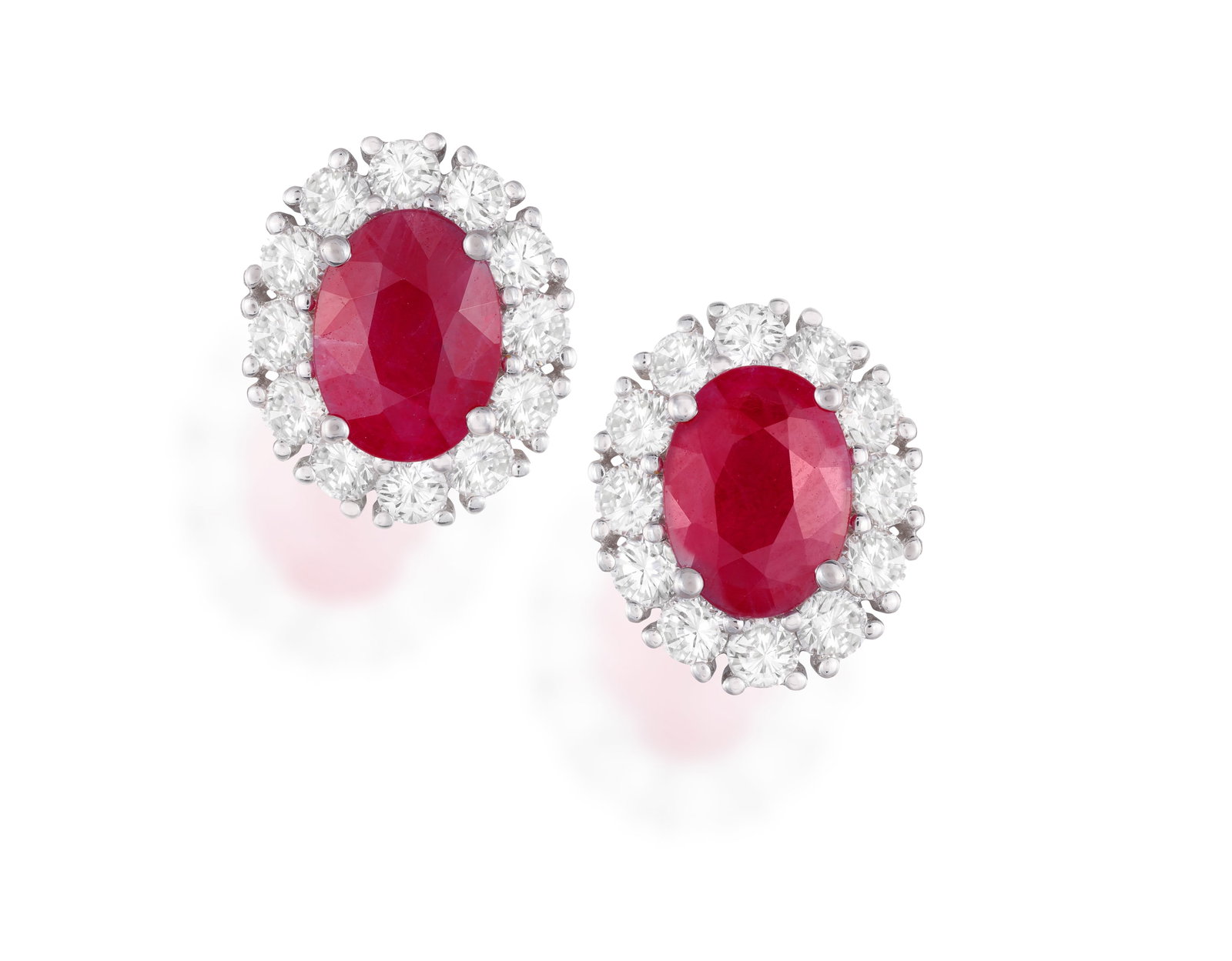 A PAIR OF RUBY AND DIAMOND EARRINGS: • Two oval-shaped rubies, approx. 2.50cts total • (1 of 2)