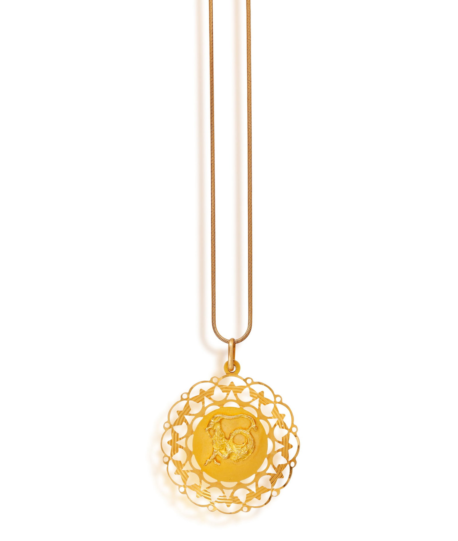 A GOLD ZODIAC PENDANT ON CHAIN • Capricorn sign motif • pierced and engraved frame (1 of 2)
