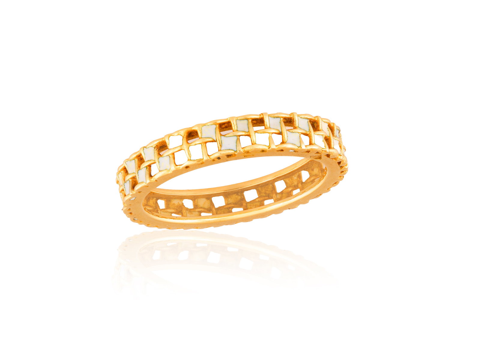 AN ENAMEL CHECKERBOARD RING • White enamel square plaques • mounted in 18K gold •  (1 of 2)