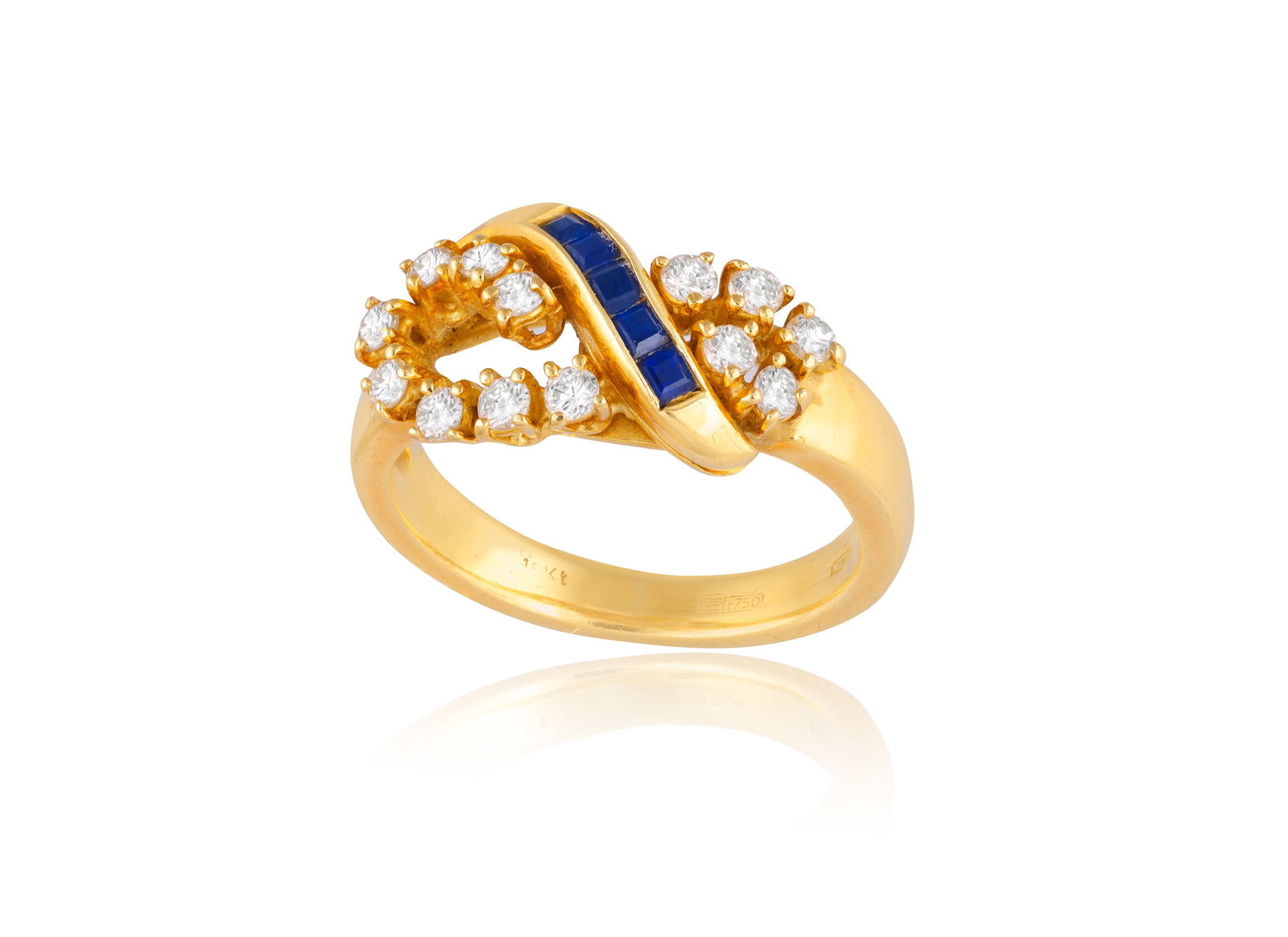 A SAPPHIRE AND DIAMOND RING • Calibré-cut sapphires • brilliant-cut diamonds • (1 of 2)
