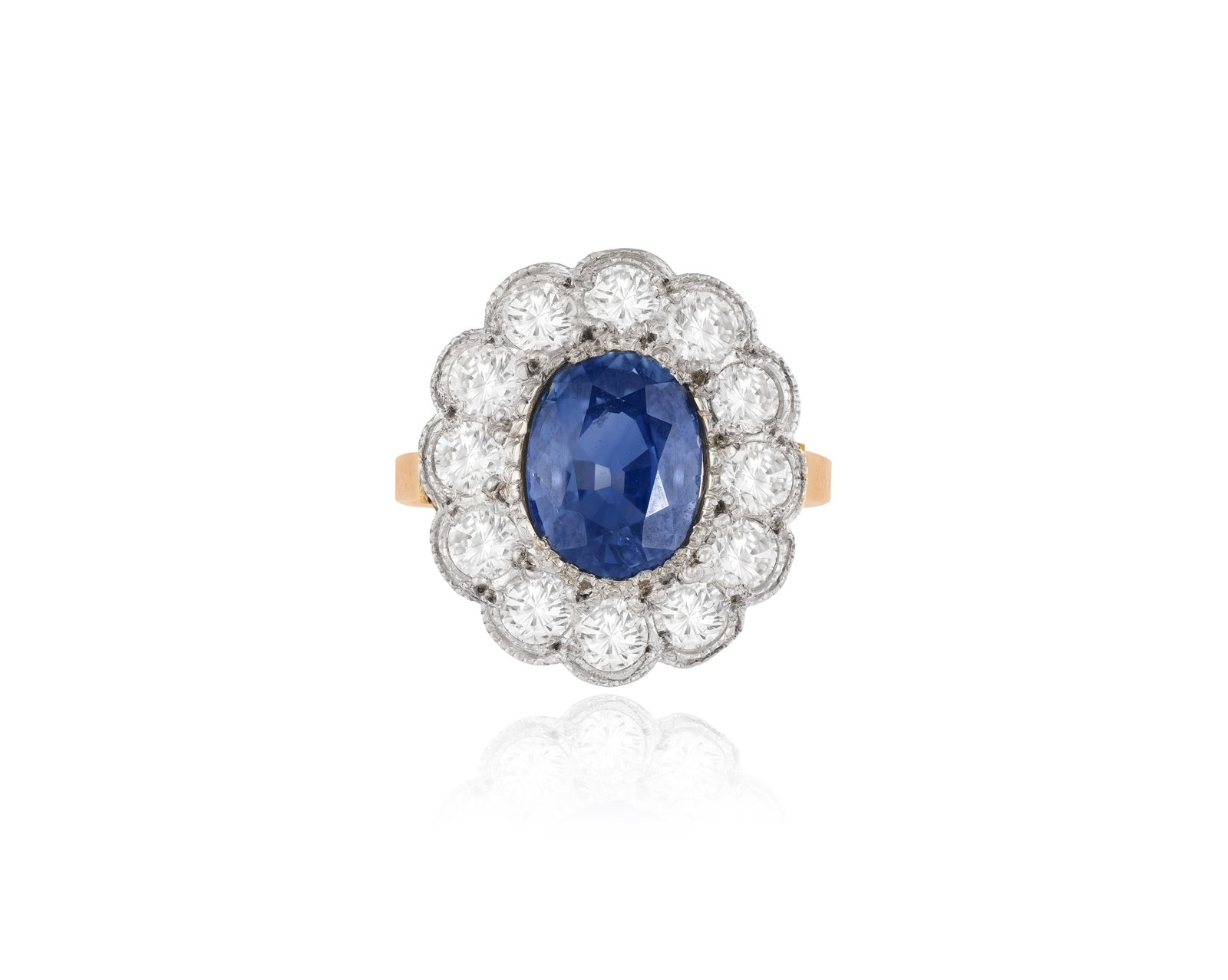 A SAPPHIRE AND DIAMOND CLUSTER RING • Oval-shaped sapphire, approx. 2.90cts • brilliant- (1 of 4)