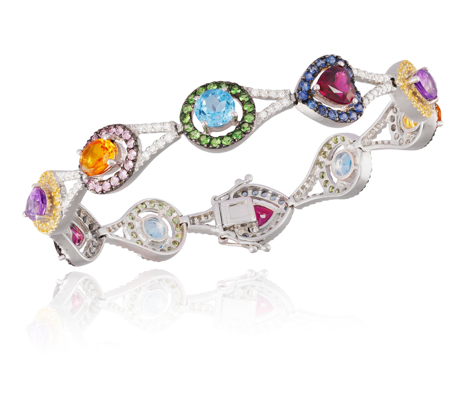 A GEM-SET AND DIAMOND BRACELET • A series of vari-cut tourmalines, topazes, amethysts,: A GEM-SET AND DIAMOND BRACELET • A series of vari-cut tourmalines, topazes, amethysts, citrines • gem-set frames • single-cut diamonds • mounted in 14K gold • length 18cm