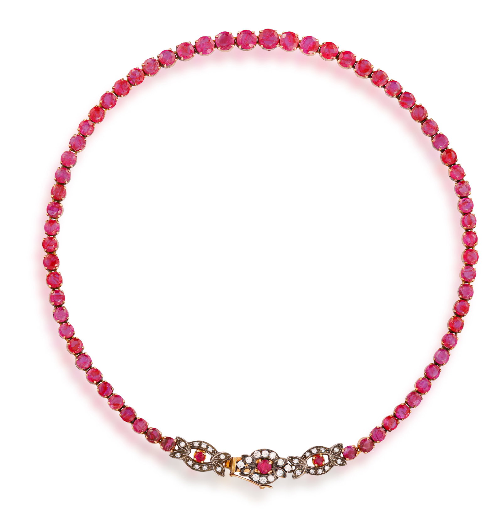 A RUBY AND DIAMOND LINE NECKLACE • Graduated circular-cut rubies • brilliant-cut: A RUBY AND DIAMOND LINE NECKLACE • Graduated circular-cut rubies • brilliant-cut diamonds • mounted in silver and gold • length 37.8cm