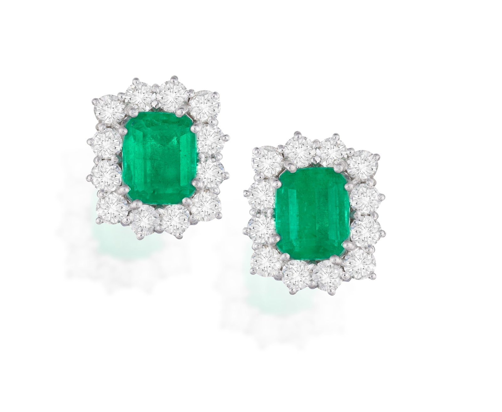 A PAIR OF EMERALD AND DIAMOND CLUSTER EARRINGS • Two rectangular-shaped emeralds, approx. (1 of 3)