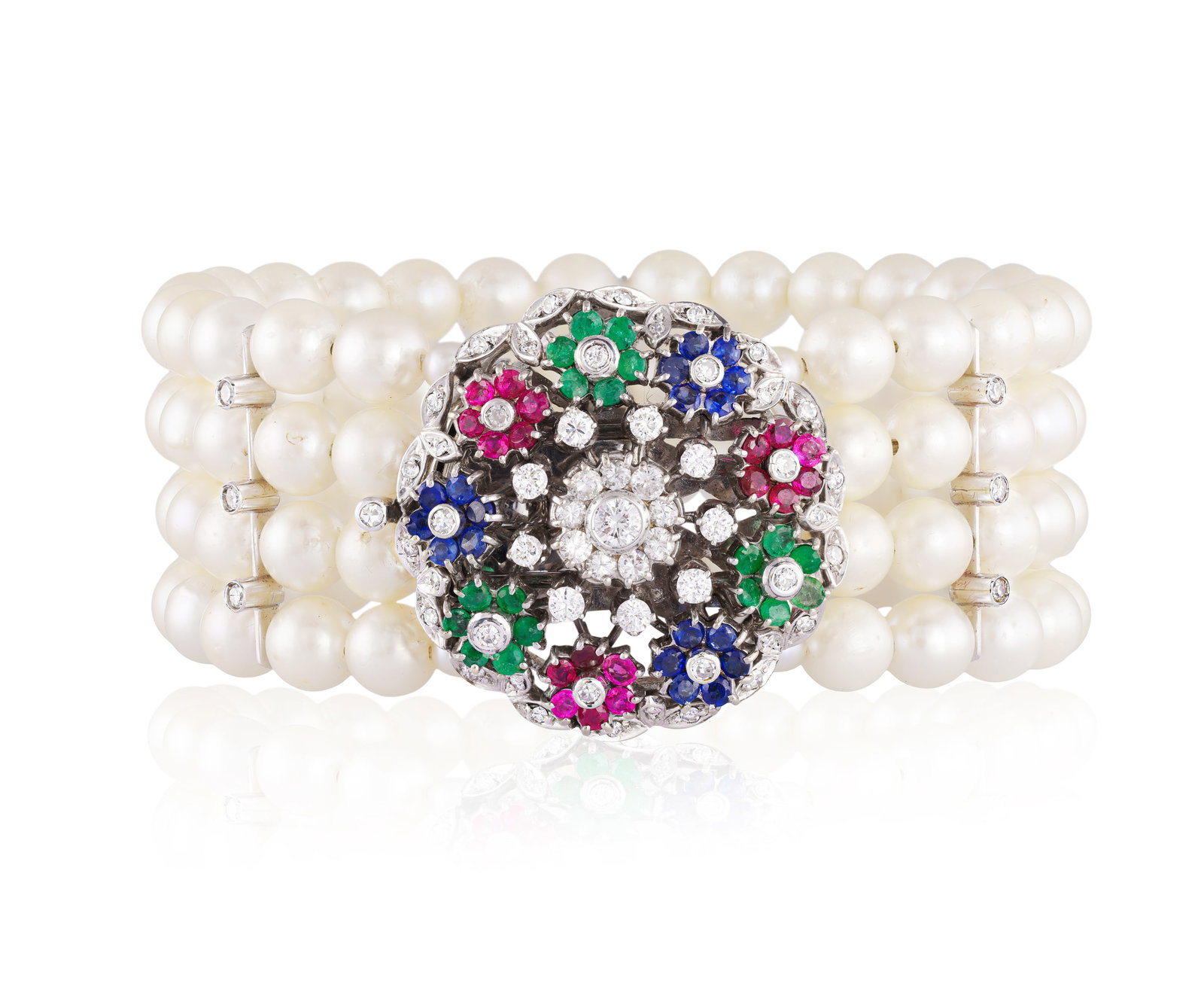 A GEM-SET, CULTURED PEARL AND DIAMOND BRACELET • Four rows of cultured pearls of cream tint: A GEM-SET, CULTURED PEARL AND DIAMOND BRACELET • Four rows of cultured pearls of cream tint • brilliant and single-cut diamonds, approx. 2.20cts total • circular-cut rubies,