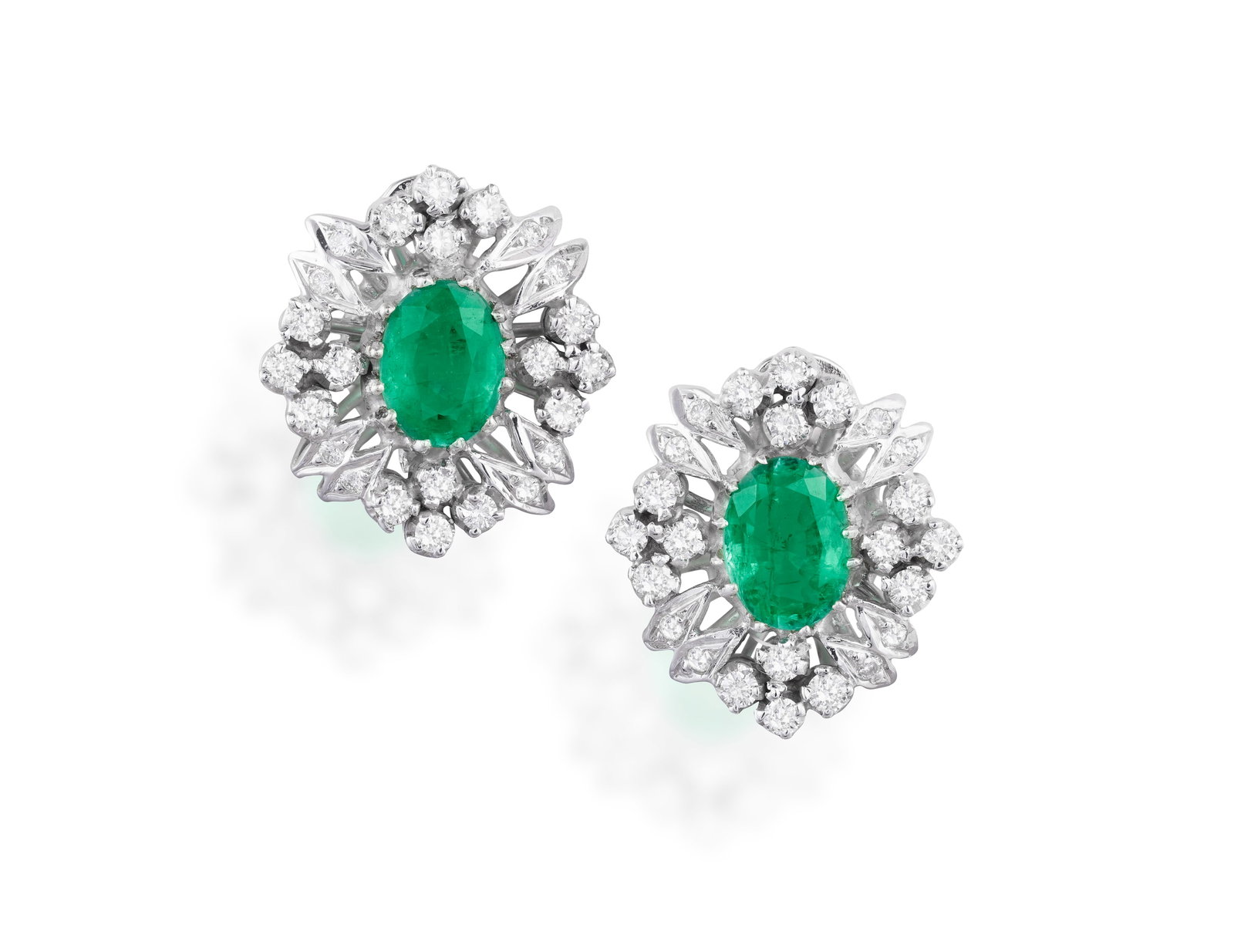 A PAIR OF EMERALD AND DIAMOND EARCLIPS • Two oval-shaped emeralds, approx. 1.50cts total (1 of 2)