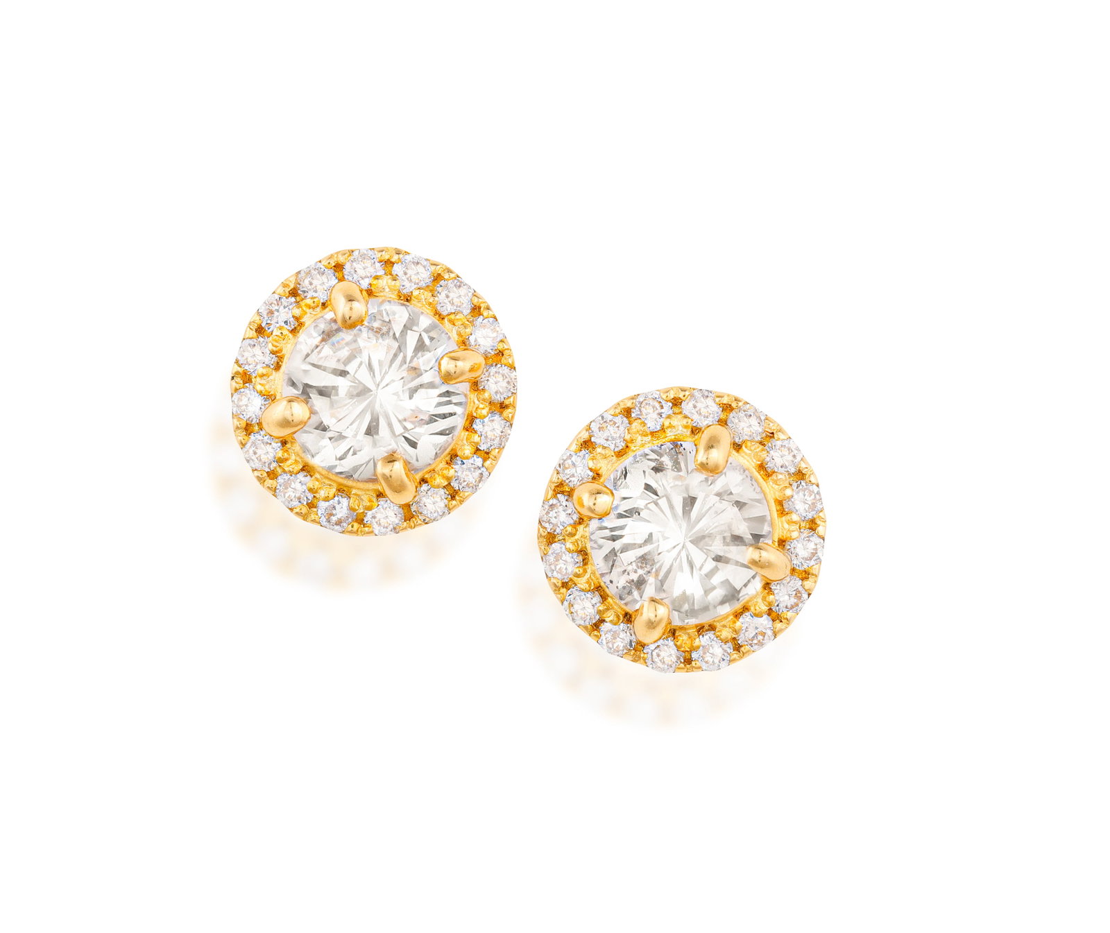 A PAIR OF DIAMOND HALO EARSTUDS • Brilliant-cut diamonds • mounted in 18K gold • (1 of 2)