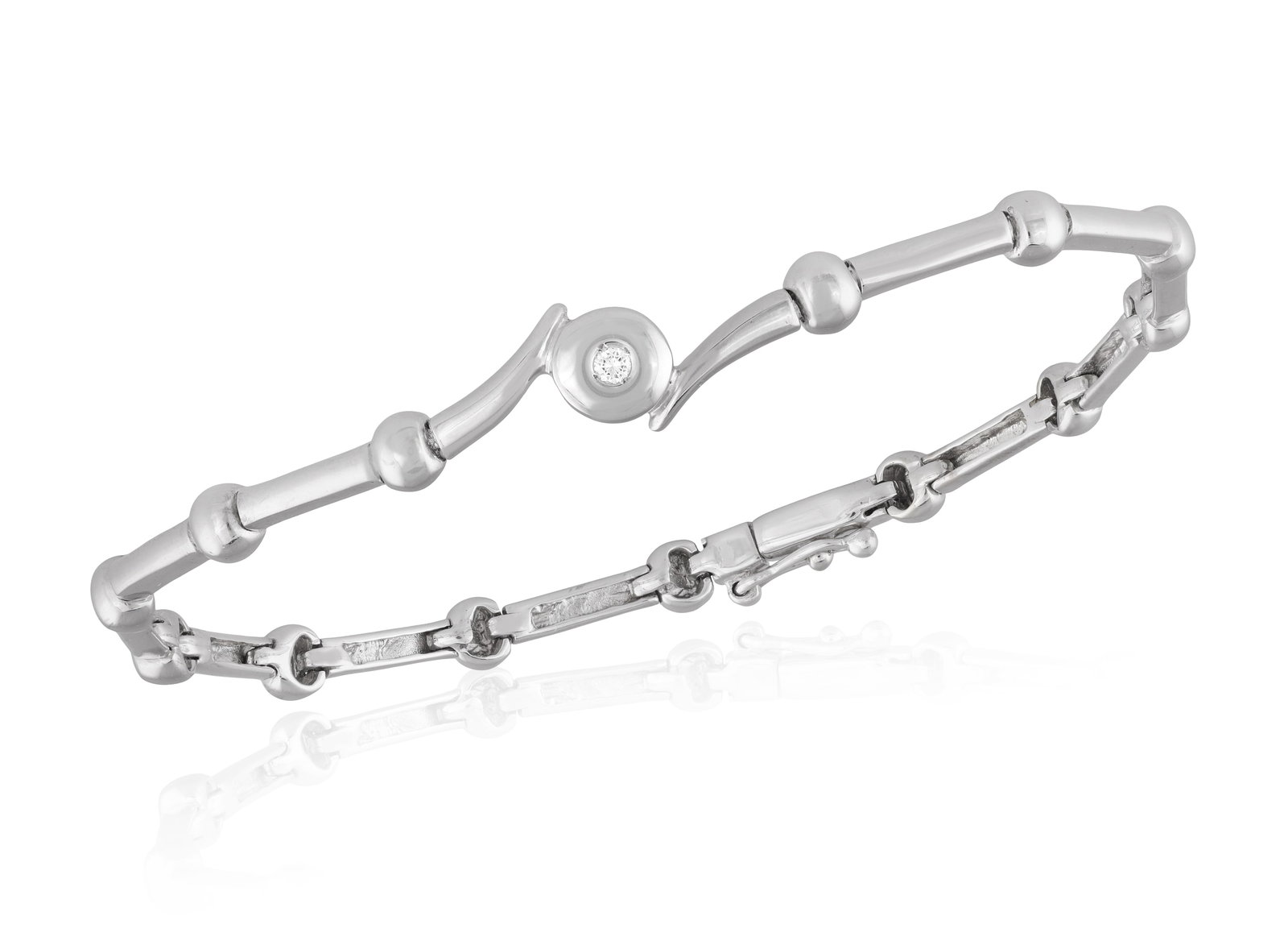 A DIAMOND BRACELET • Bar and sphere links • a brilliant-cut diamond • mounted in 1 (1 of 3)