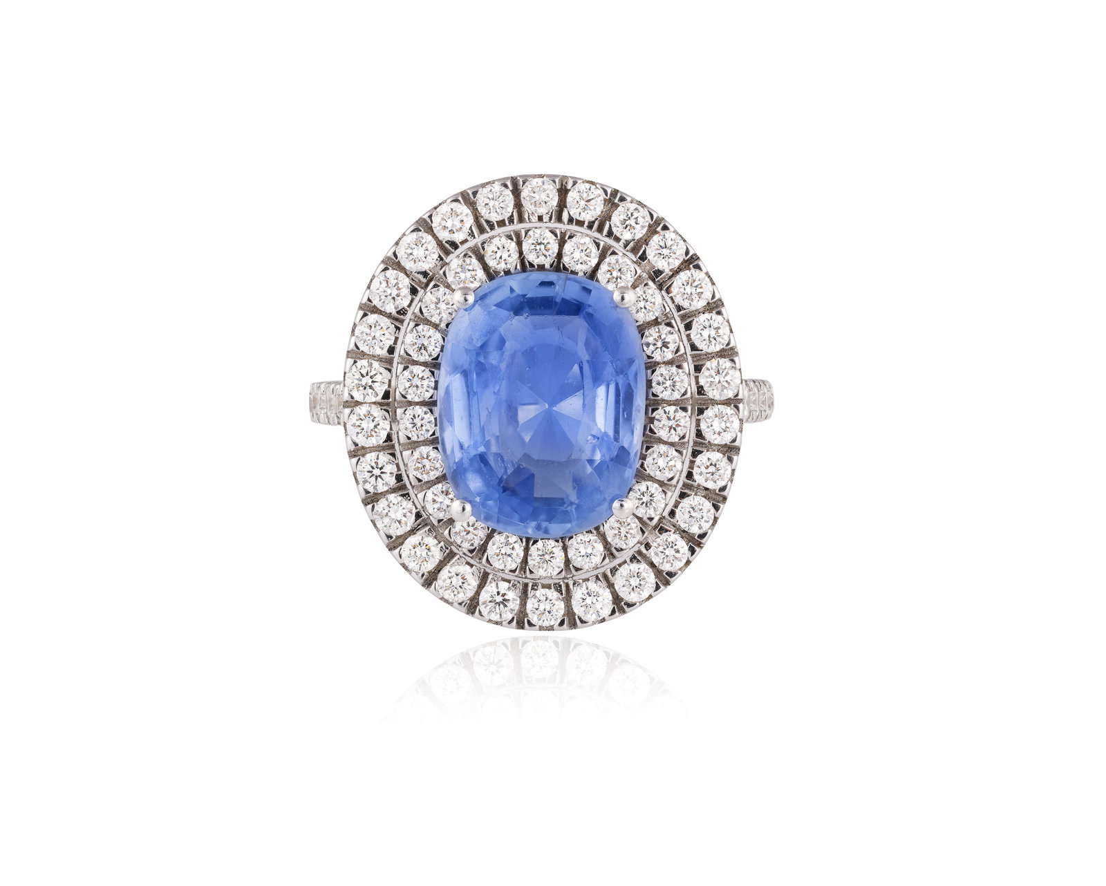 A SAPPHIRE AND DIAMOND CLUSTER RING • Cushion-shaped sapphire • brilliant-cut diamonds,  (1 of 4)