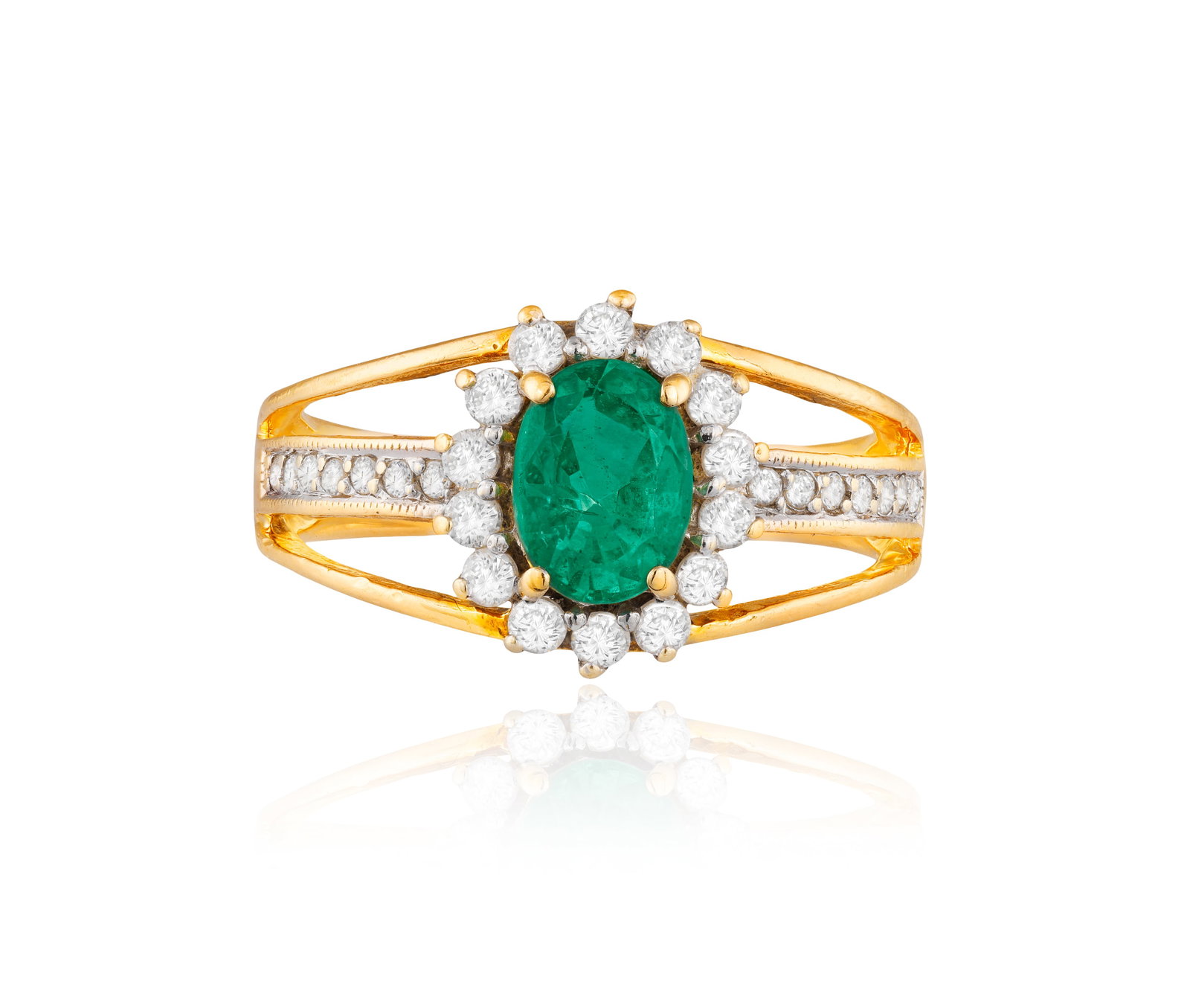 AN EMERALD AND DIAMOND RING • Oval-shaped emerald • brilliant-cut diamonds • (1 of 4)