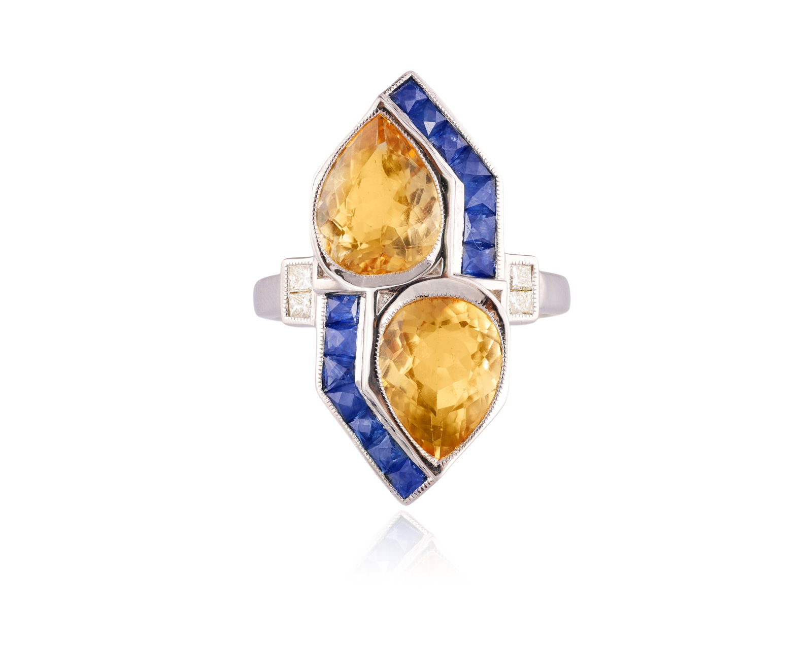 A TOPAZ, SAPPHIRE AND DIAMOND DRESS RING • Pear-shaped topazes, approx. 4.70cts total •: A TOPAZ, SAPPHIRE AND DIAMOND DRESS RING • Pear-shaped topazes, approx. 4.70cts total • calibré-cut sapphires • princess-cut diamonds • mounted in 18K gold • French