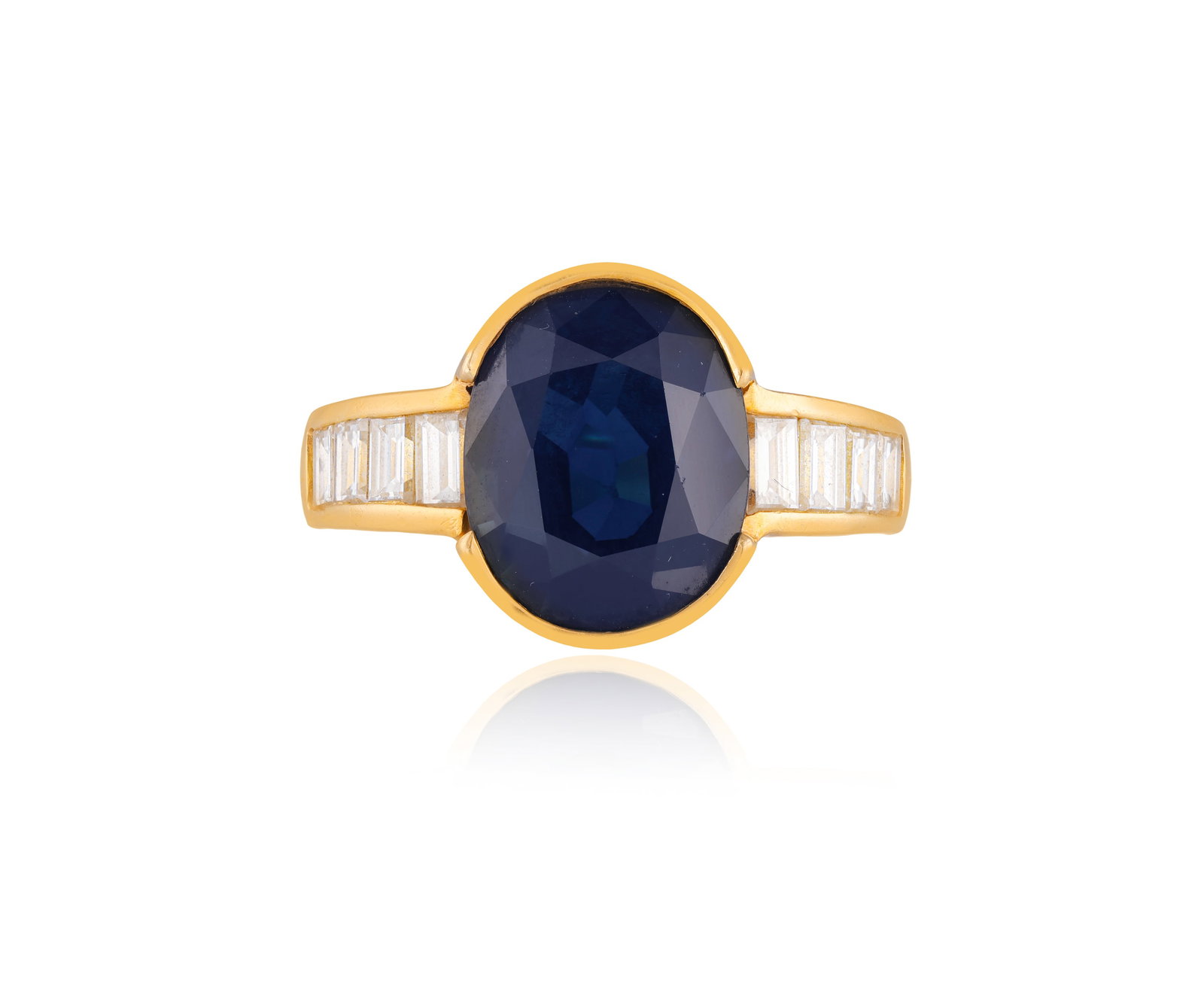 A SAPPHIRE AND DIAMOND DRESS RING • Oval-shaped sapphire, approx. 5.50cts • baguette-cut: A SAPPHIRE AND DIAMOND DRESS RING • Oval-shaped sapphire, approx. 5.50cts • baguette-cut diamonds • mounted in 18K gold • ring size L⅔