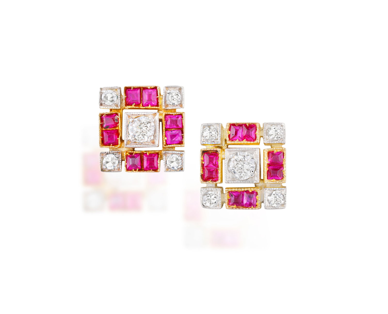 A PAIR OF RUBY AND DIAMOND EARSTUDS • Old brilliant-cut diamonds • calibré-cut (1 of 2)
