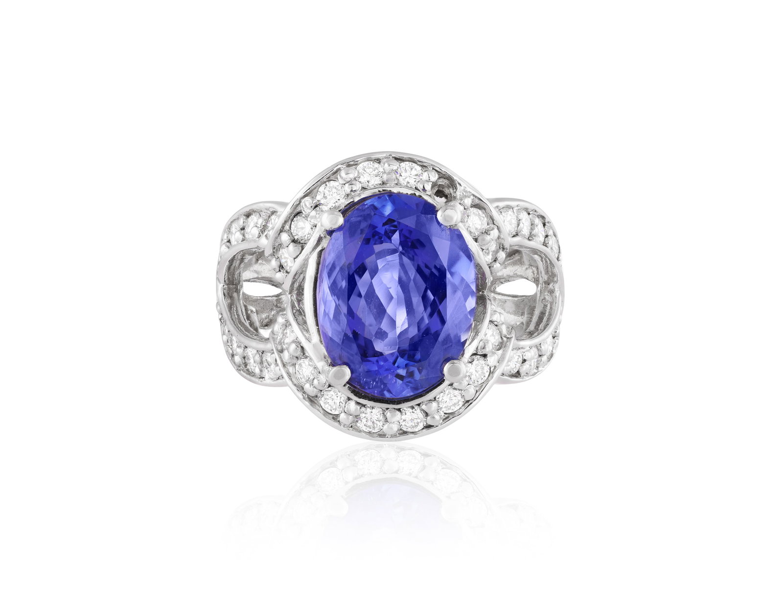 A TANZANITE AND DIAMOND DRESS RING • Oval-shaped tanzanite, approx. 3.70cts • brilliant- (1 of 3)