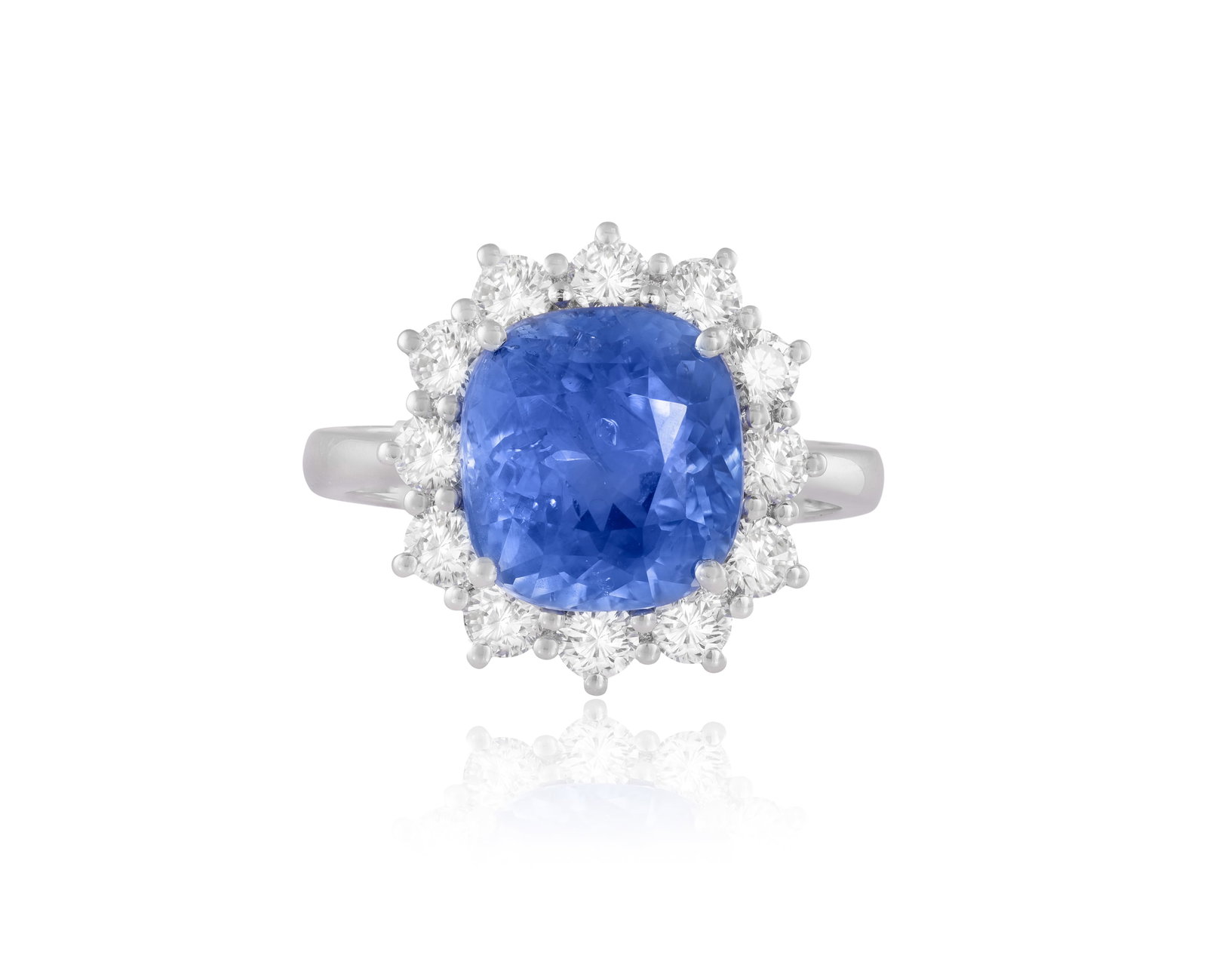 A SAPPHIRE AND DIAMOND CLUSTER RING • Cushion-shaped sapphire, approx. 5.60cts • brillia (1 of 3)