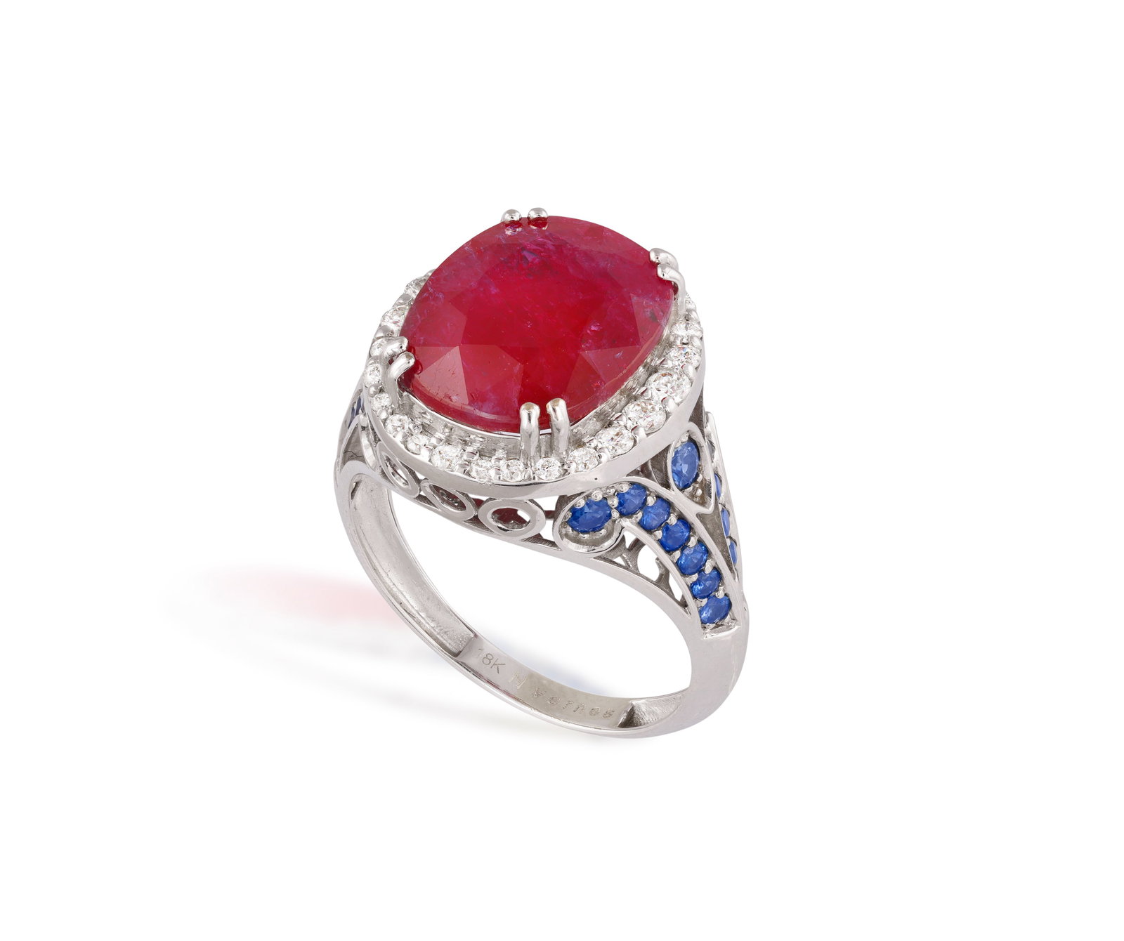 A RUBY, SAPPHIRE AND DIAMOND RING • Oval-shaped ruby • brilliant-cut diamonds • ci (1 of 3)
