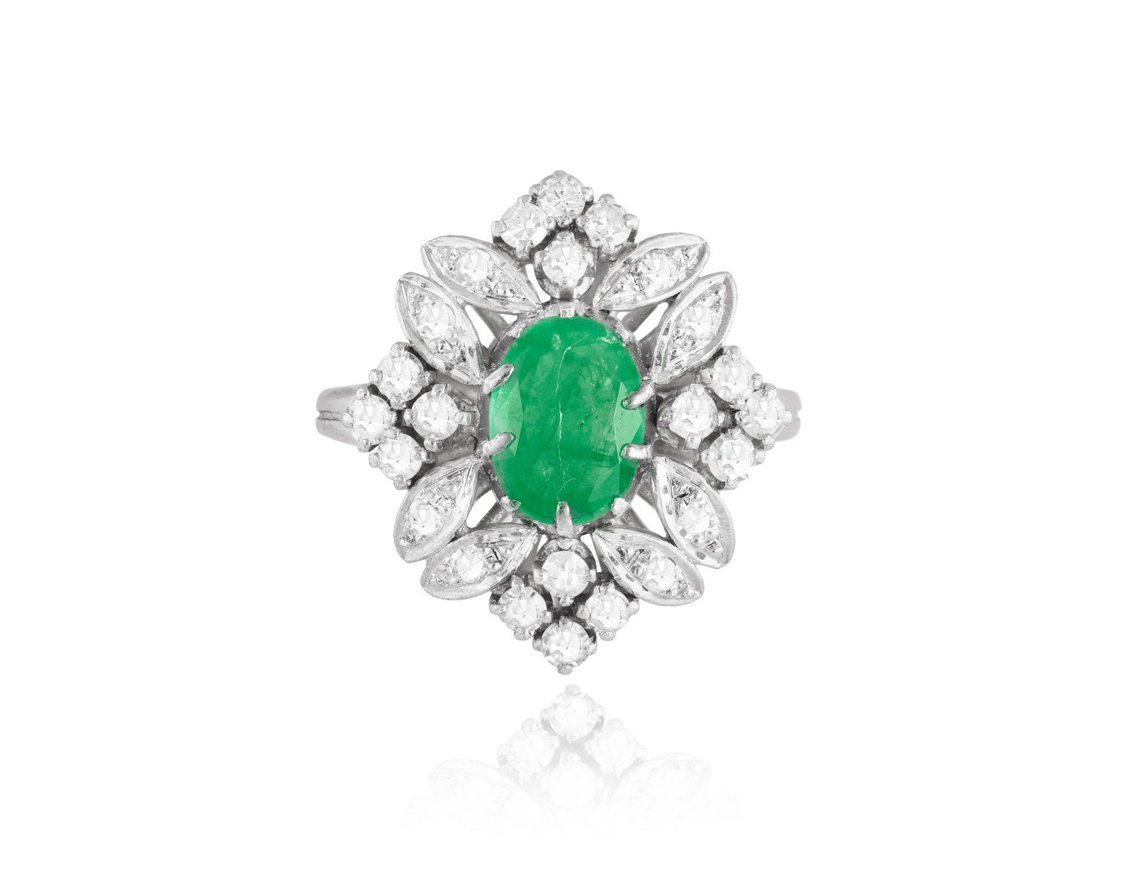AN EMERALD AND DIAMOND CLUSTER RING • Oval-shaped emerald • single-cut diamonds, approx. (1 of 3)
