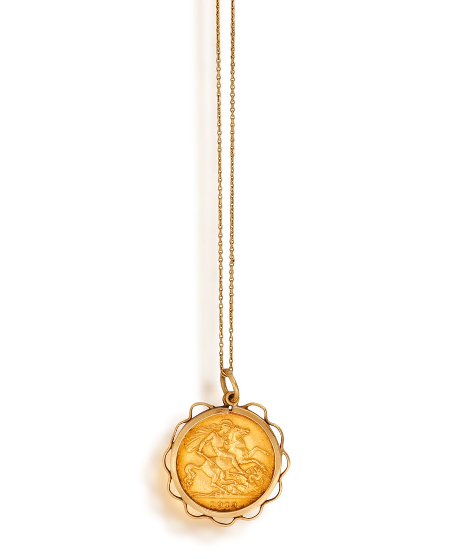 A HALF-SOVEREIGN GOLD COIN PENDANT ON CHAIN • A King George V half Sovereign gold coin •: A HALF-SOVEREIGN GOLD COIN PENDANT ON CHAIN • A King George V half Sovereign gold coin • reverse with Saint George slaying the Dragon • scrolled surround • fine cable-link chai