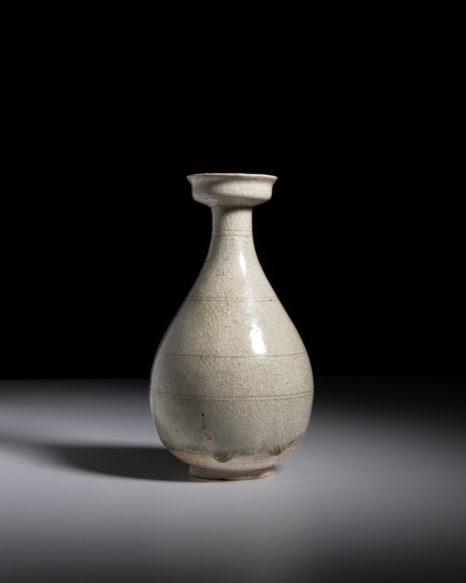 A CELADON-GLAZED DISH-MOUTHED PEAR-SHAPED VASE 北齐 青釉盘口 (1 of 4)